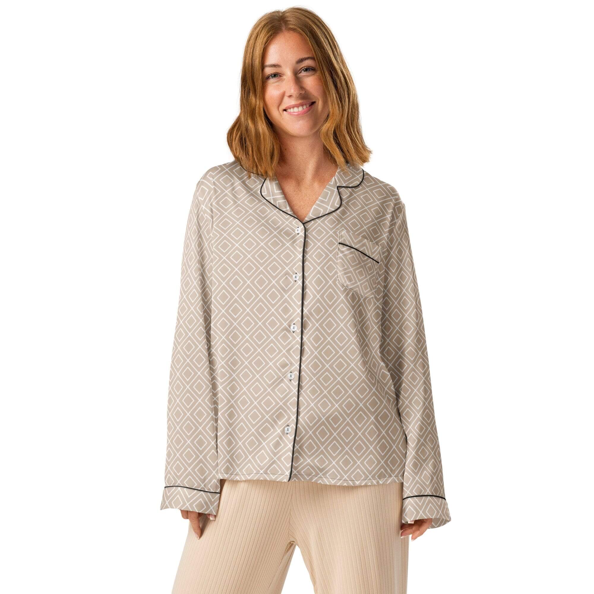 Woman wearing patterned pajamas, smiling.