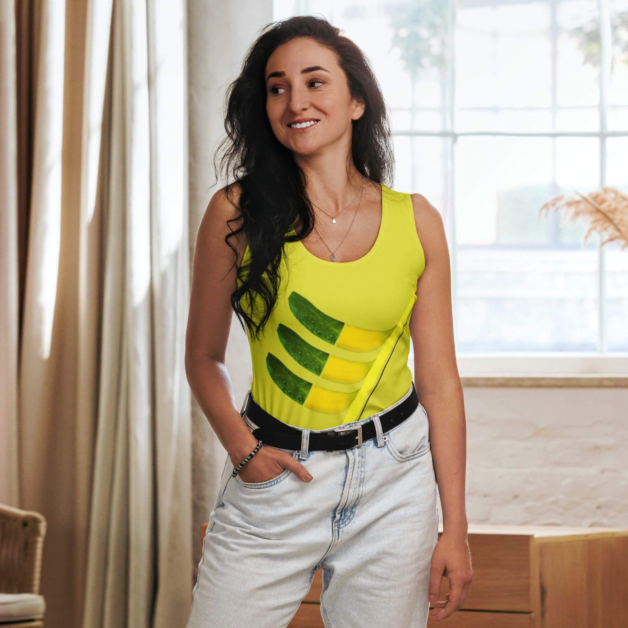 Woman in yellow shirt posing indoors, smiling.