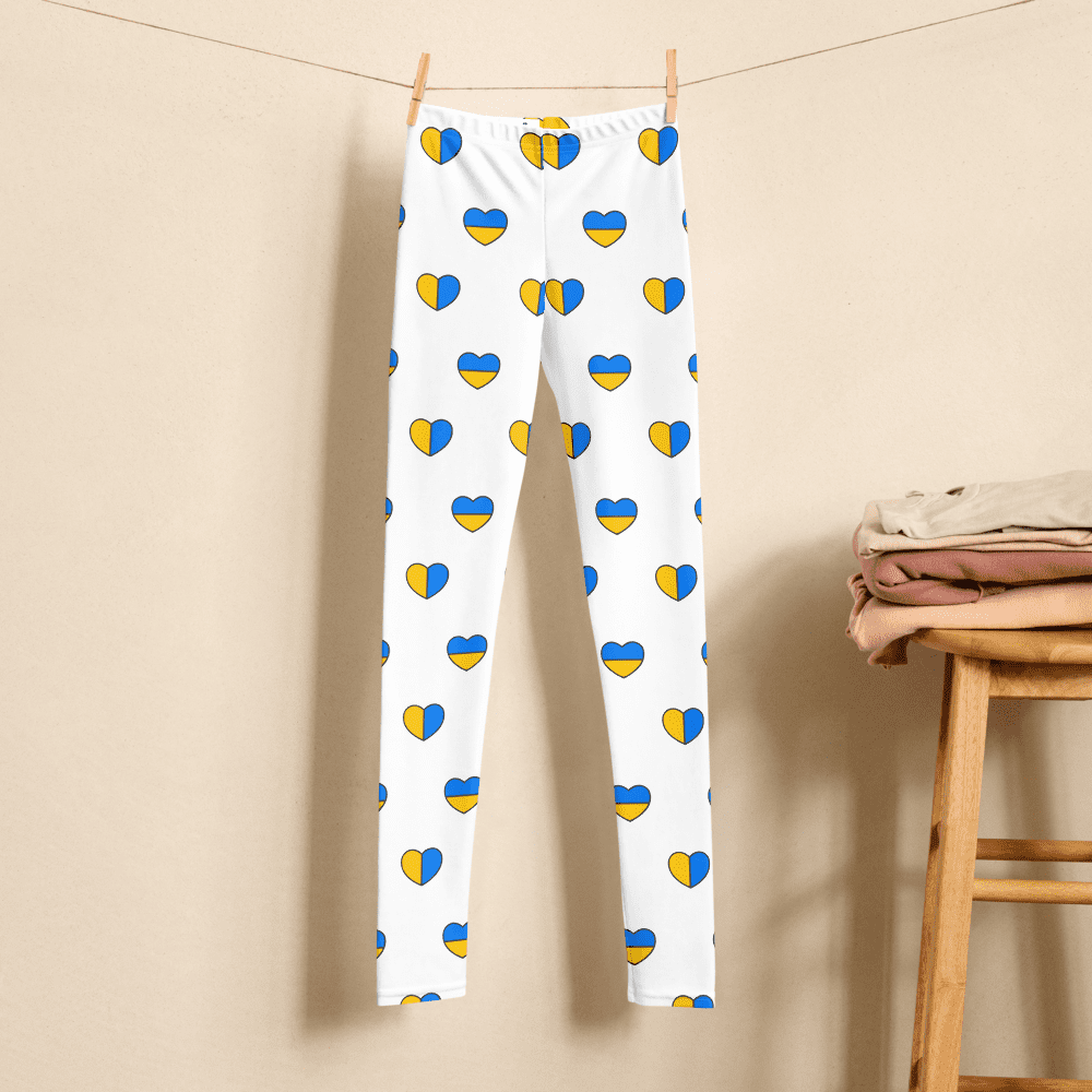White leggings with blue-yellow heart pattern