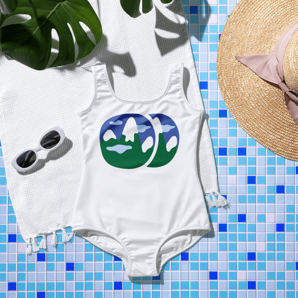 Swimsuit and accessories on tiled surface.