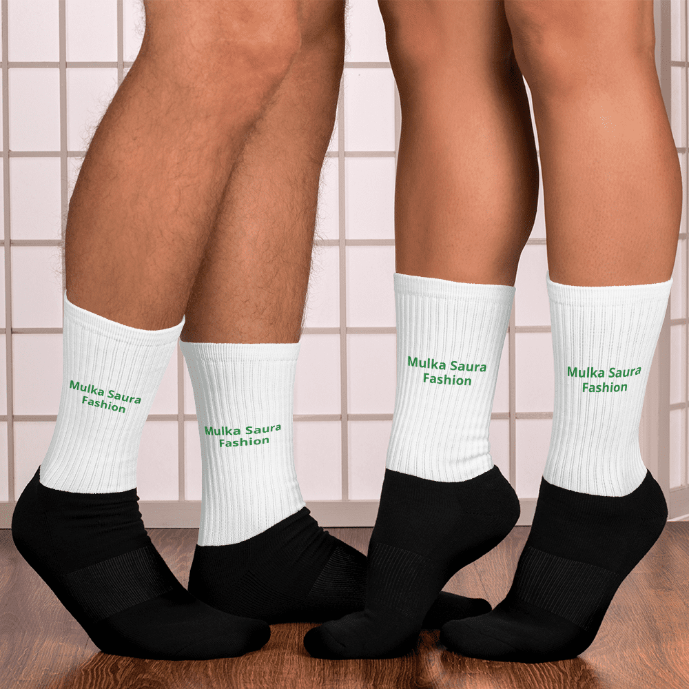 Two people wearing white socks indoors.