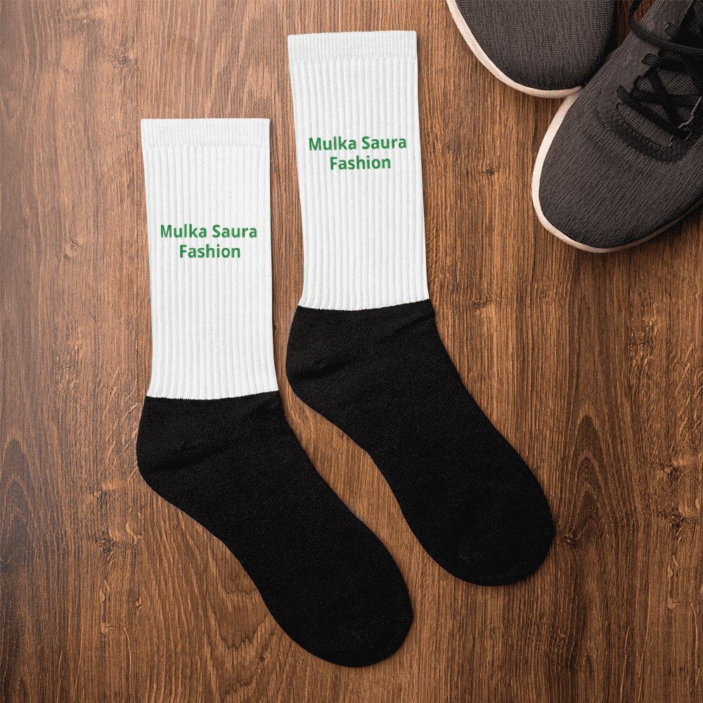 Two-tone socks with green text design.