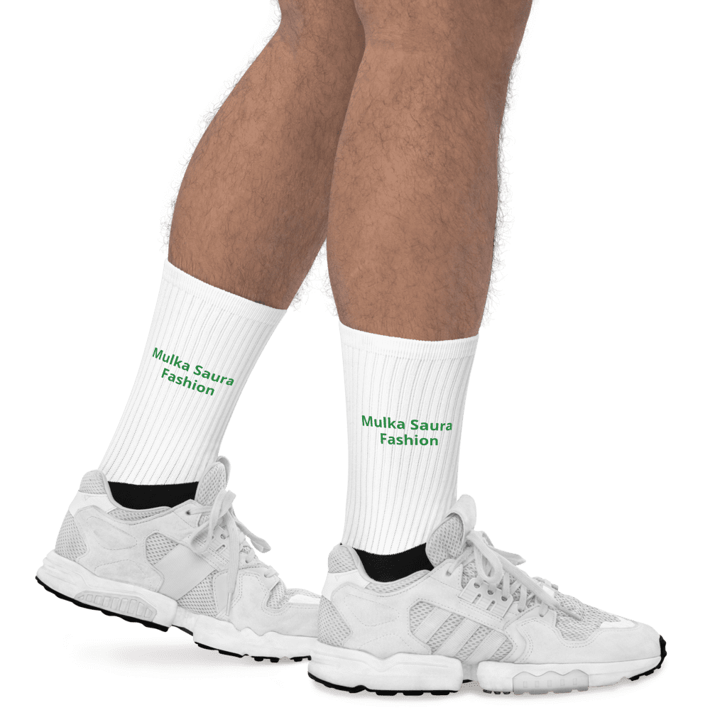 Legs wearing white socks and sneakers.