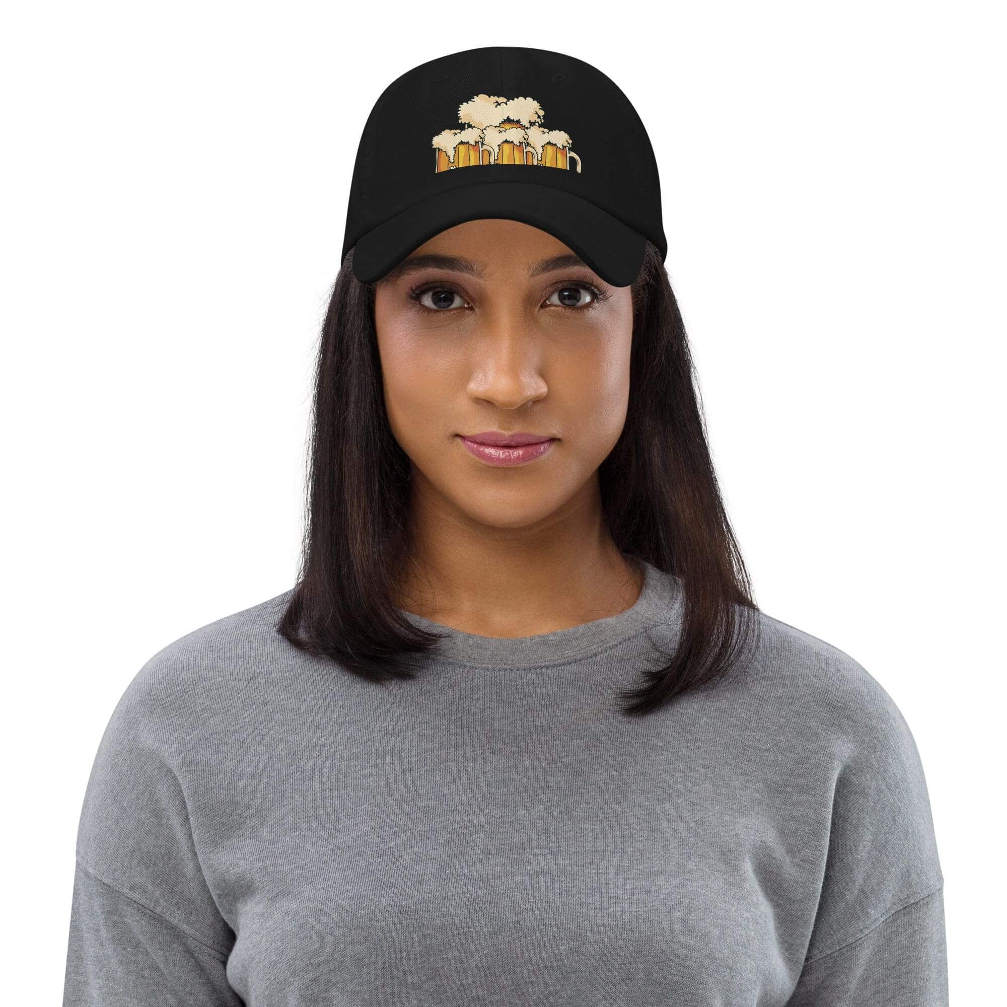 Woman wearing a cap with beer mugs.