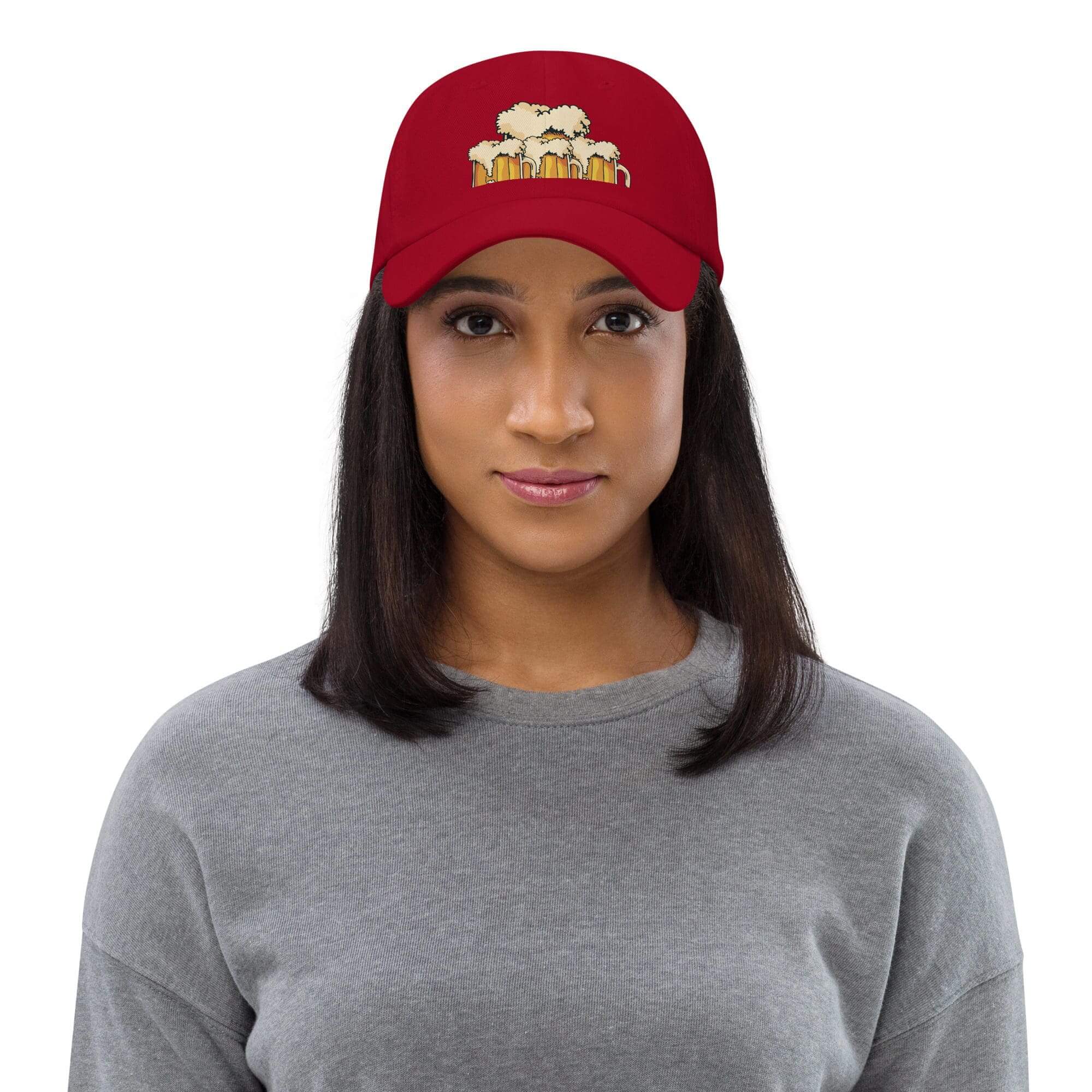 Woman wearing red hat with popcorn design.