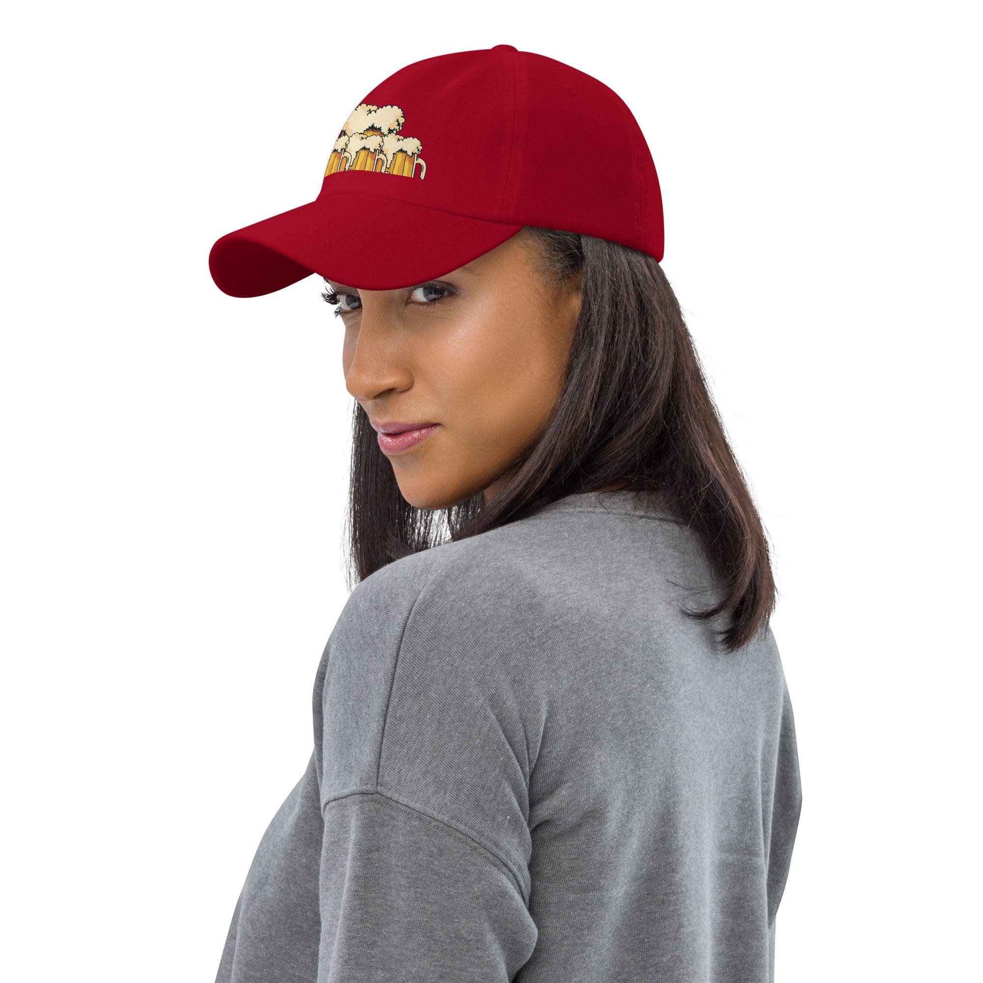Woman wearing red cap with beer design.
