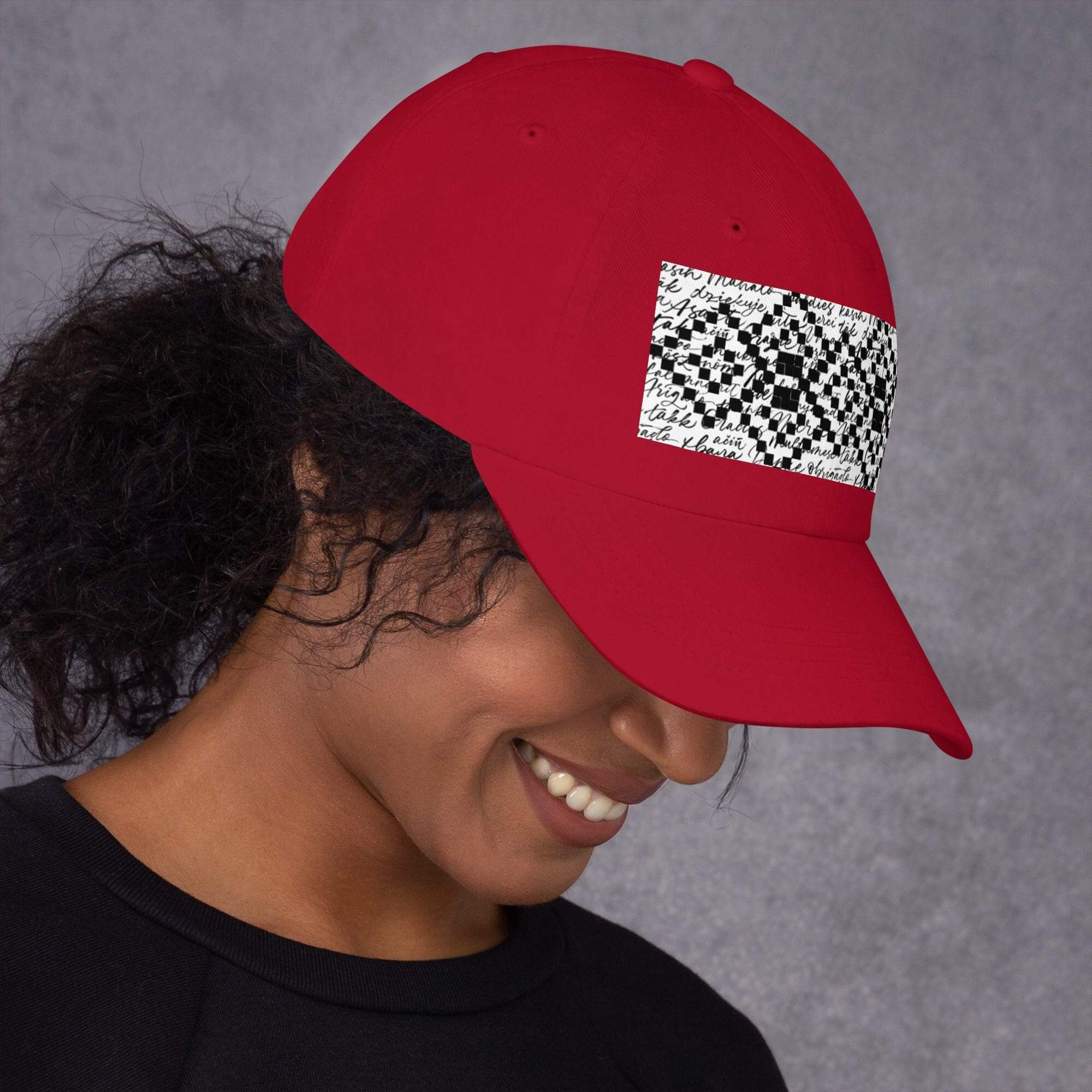 Person wearing red hat with patterned design.