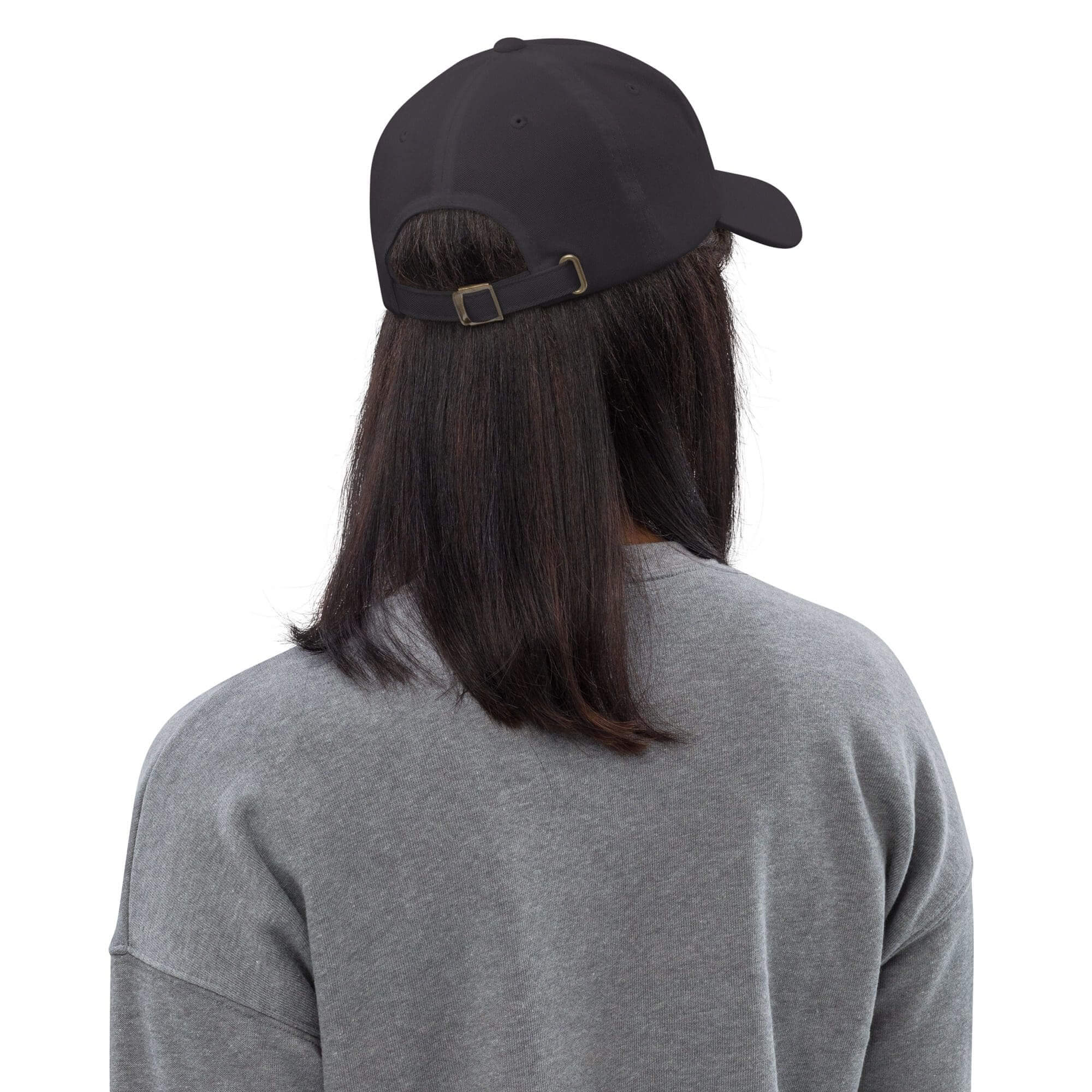 Person wearing black cap and gray shirt.