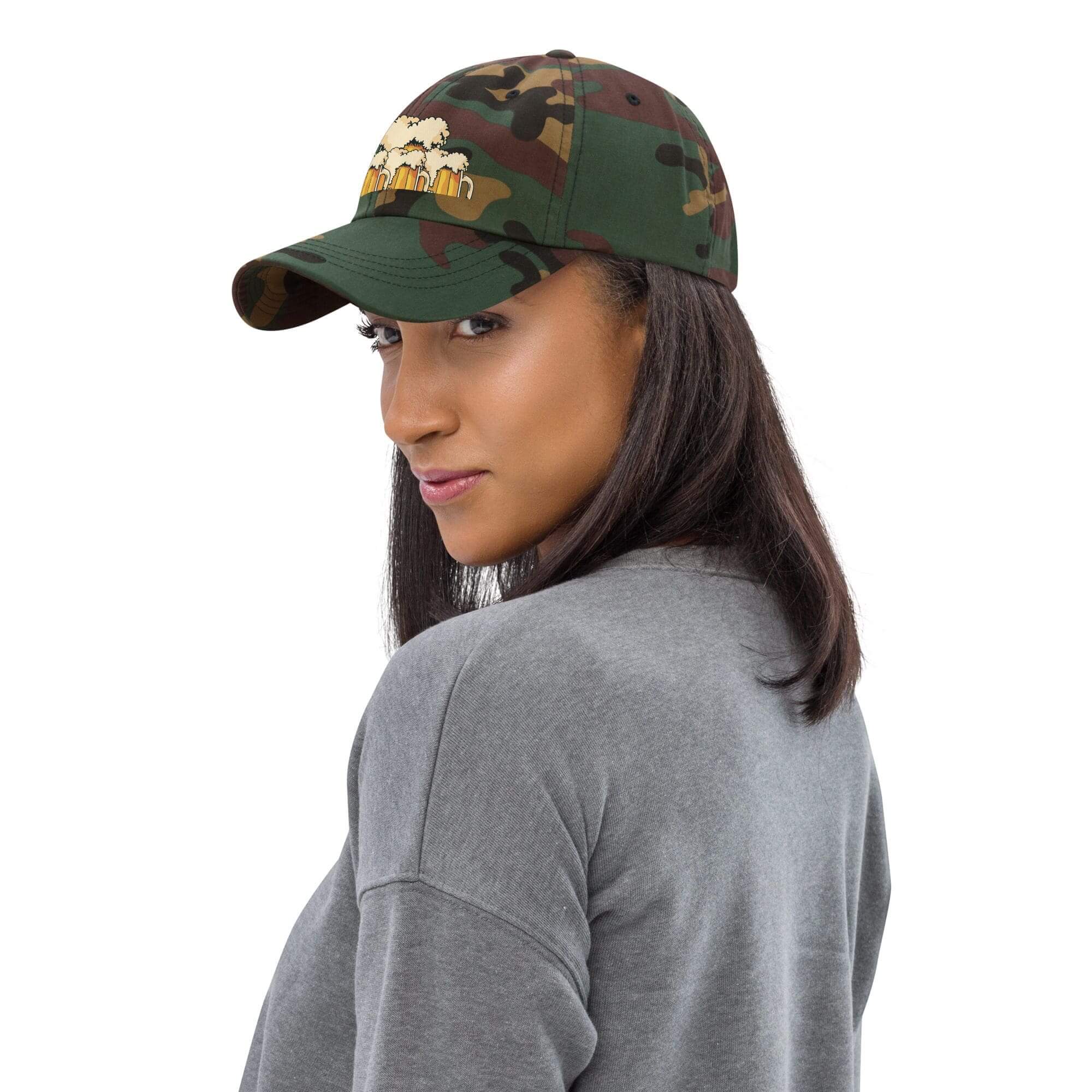 Woman wearing camo hat, gray sweater.
