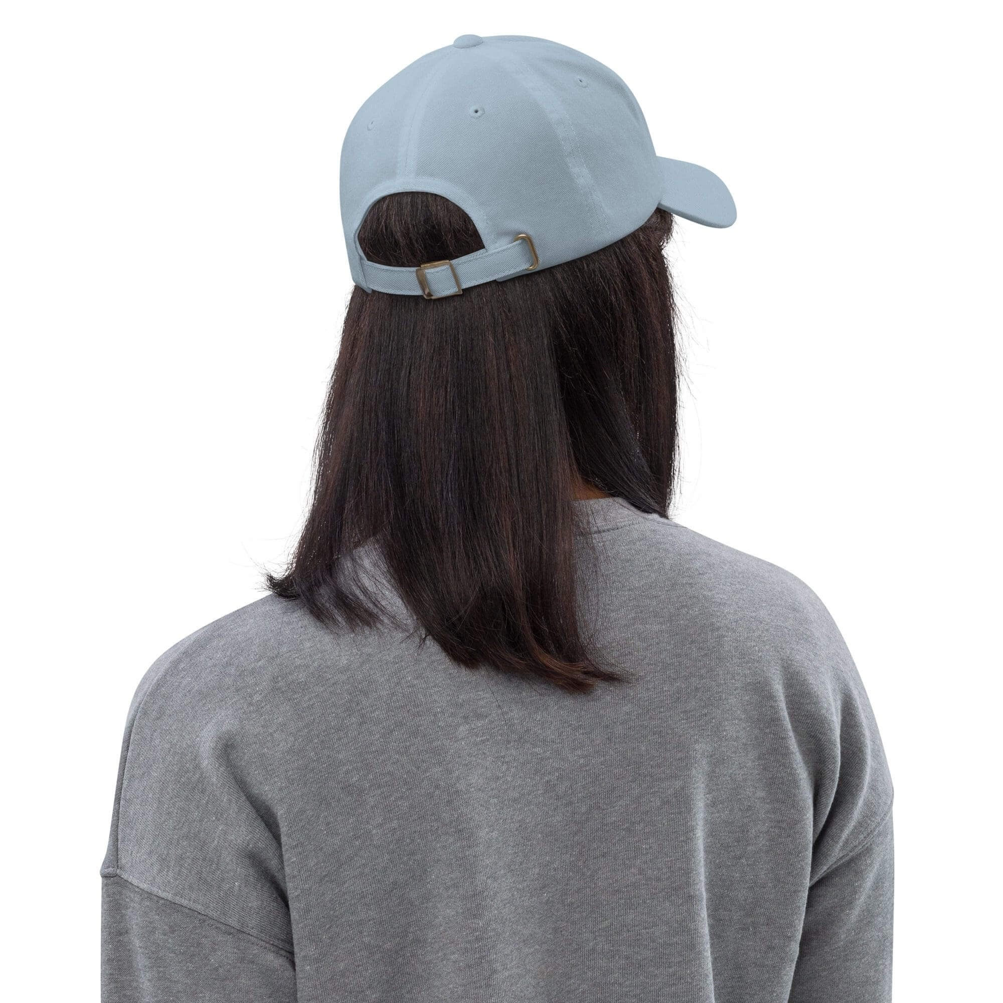 Person wearing blue cap and gray sweatshirt.