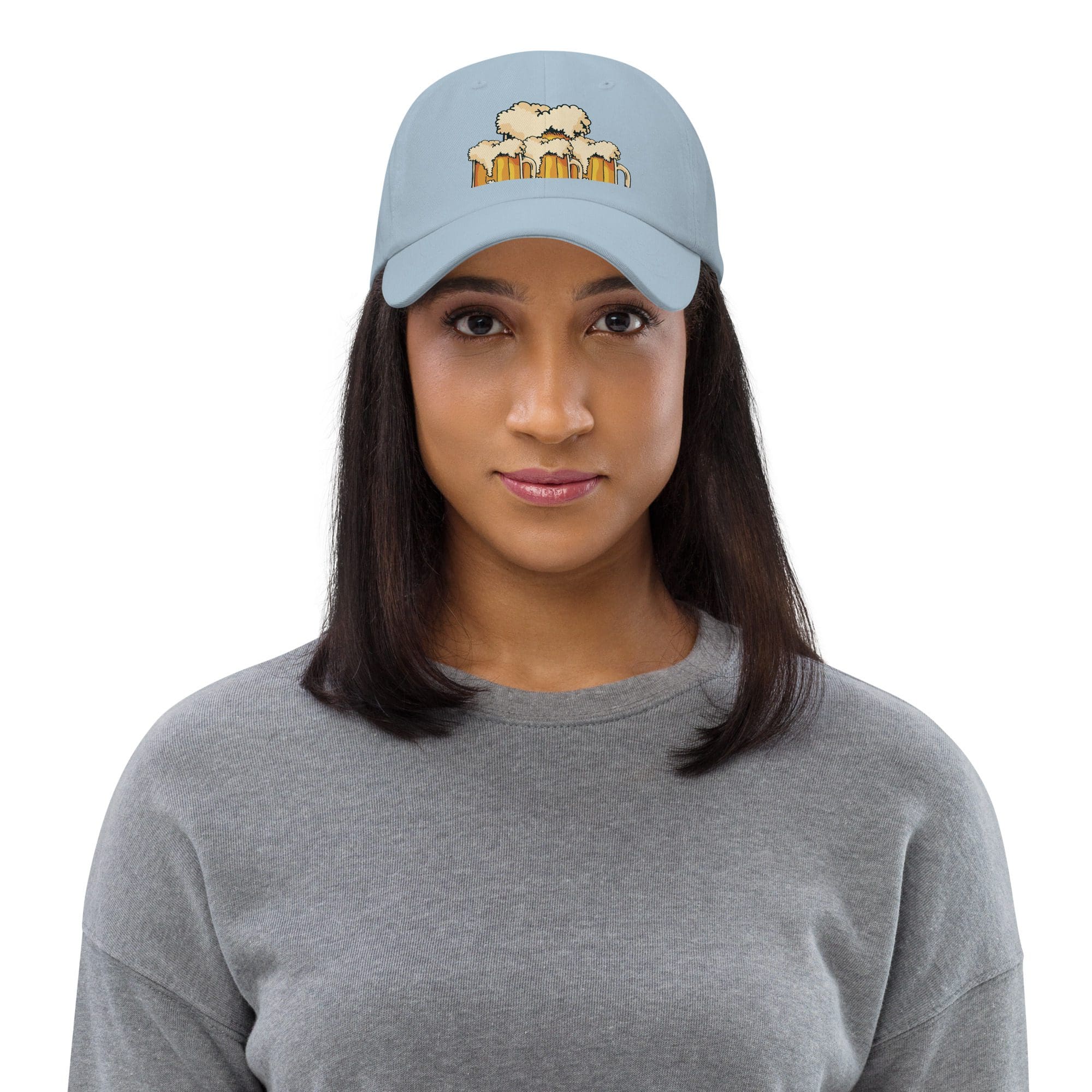 Woman wearing a light blue embroidered cap.