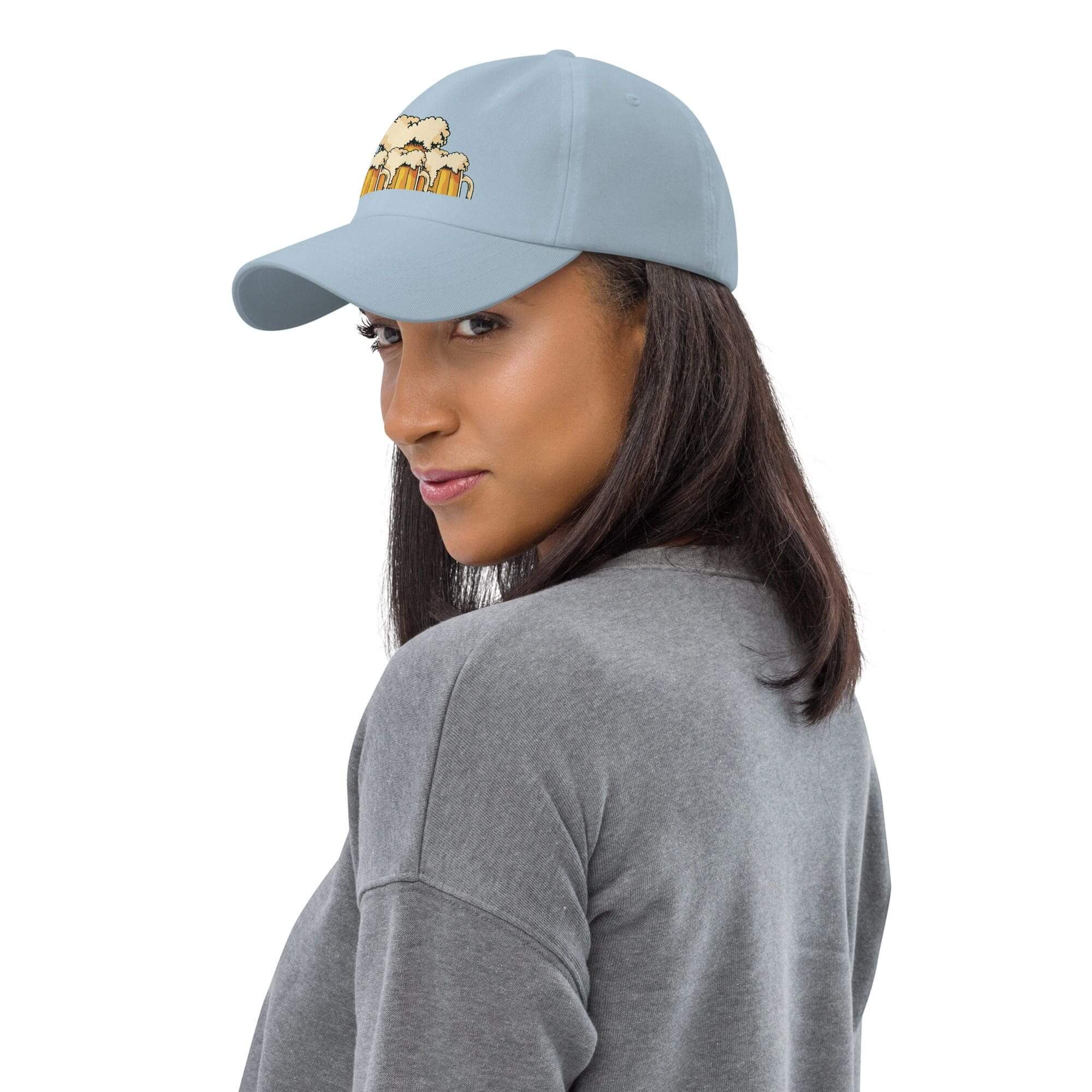 Woman wearing a blue cap, gray shirt.