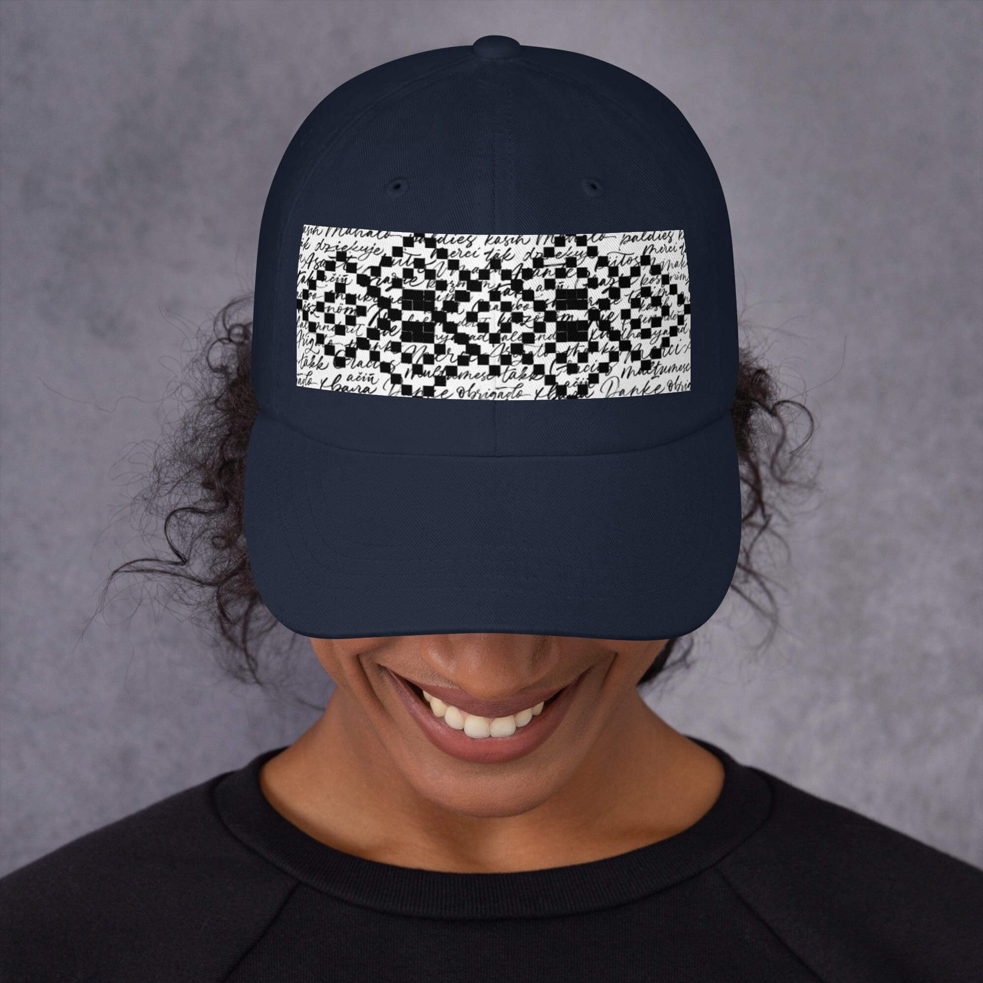Person wearing cap with geometric pattern design.