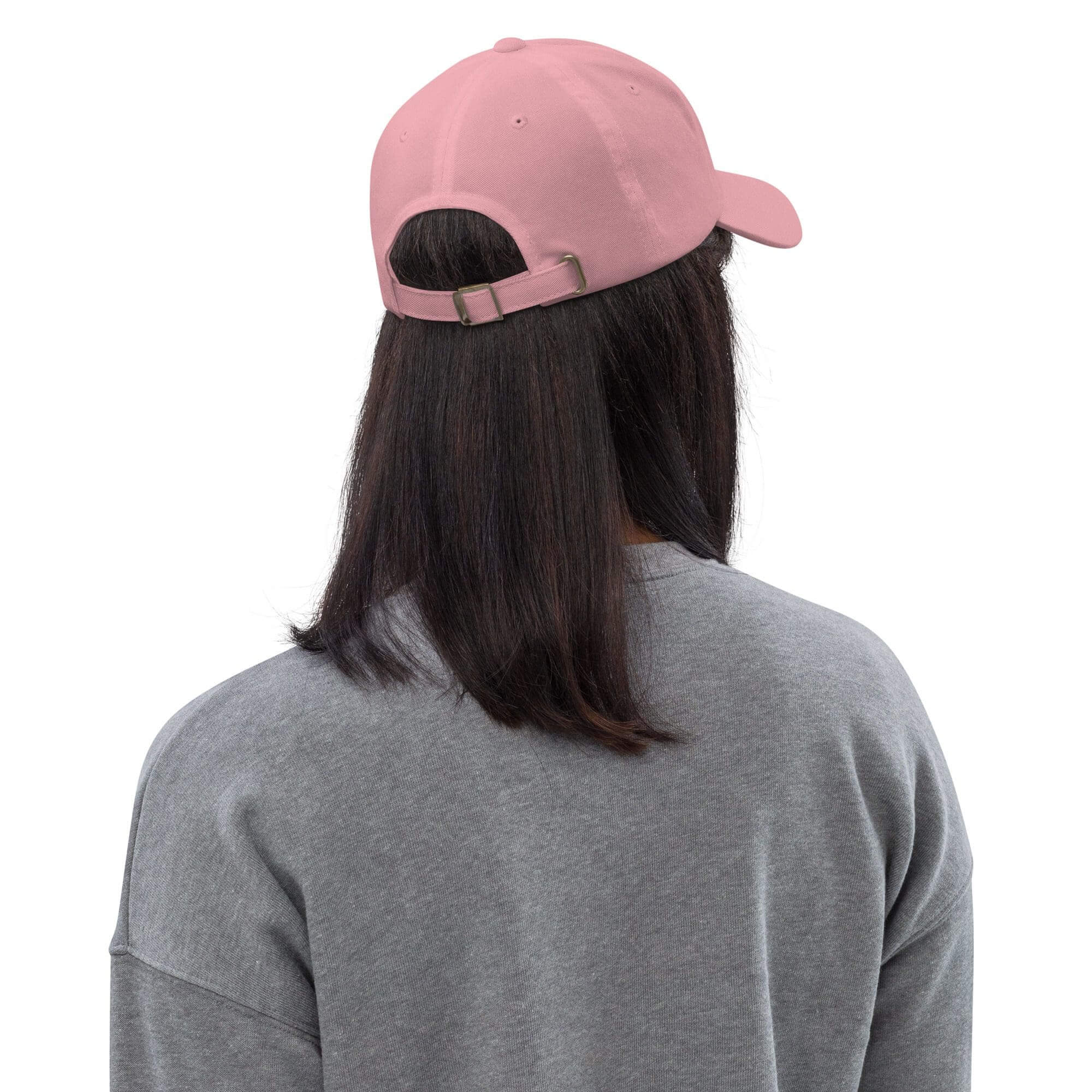 Person wearing pink cap and gray shirt.