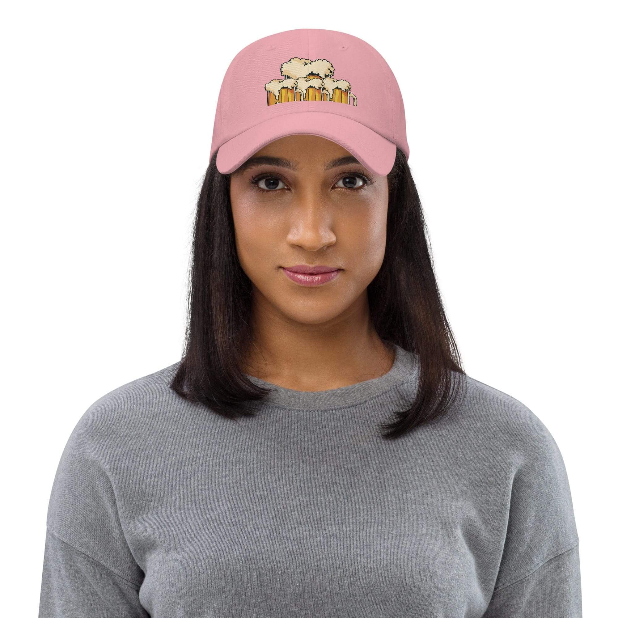 Woman wearing pink cap with bear design.