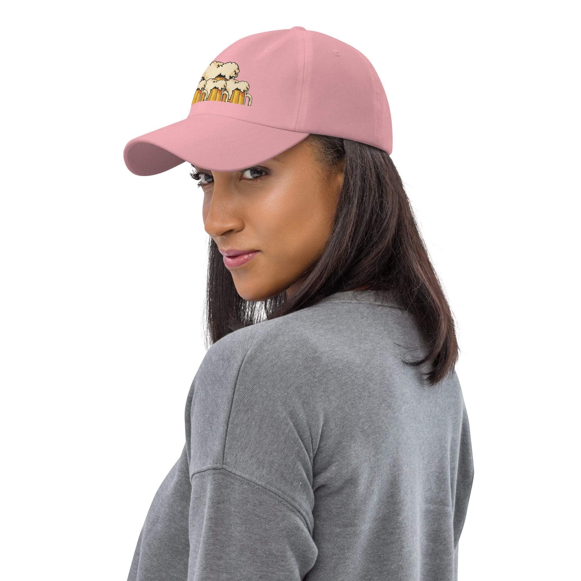 Woman wearing pink cap and gray sweatshirt.