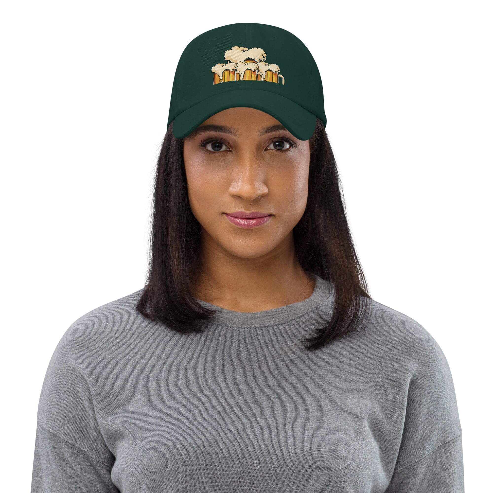 Woman wearing green hat with beer mugs.