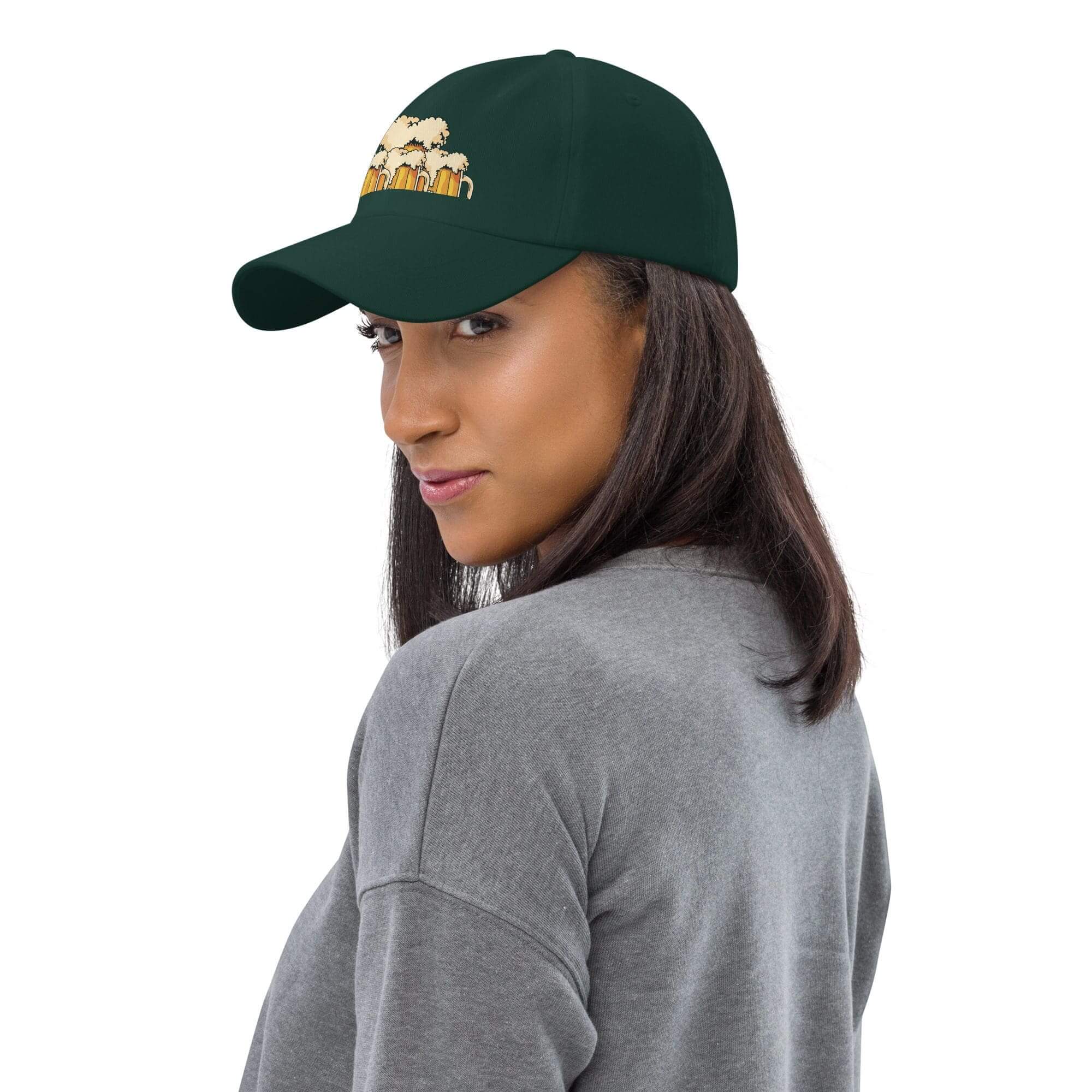 Woman wearing green cap with graphic design.