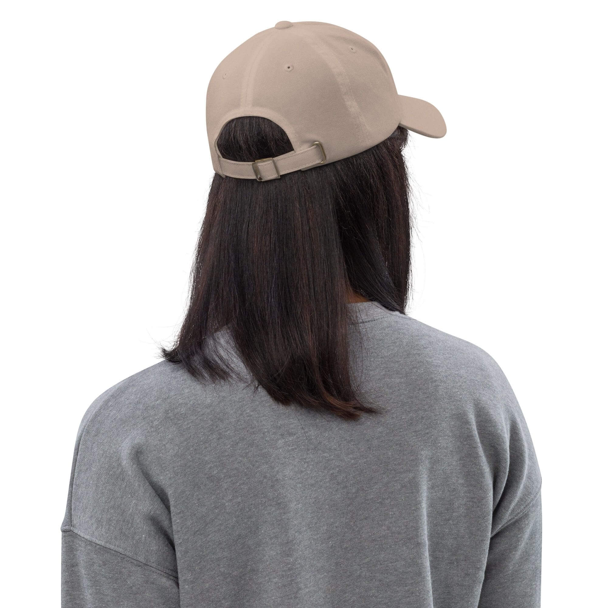 Person wearing grey shirt and beige cap.