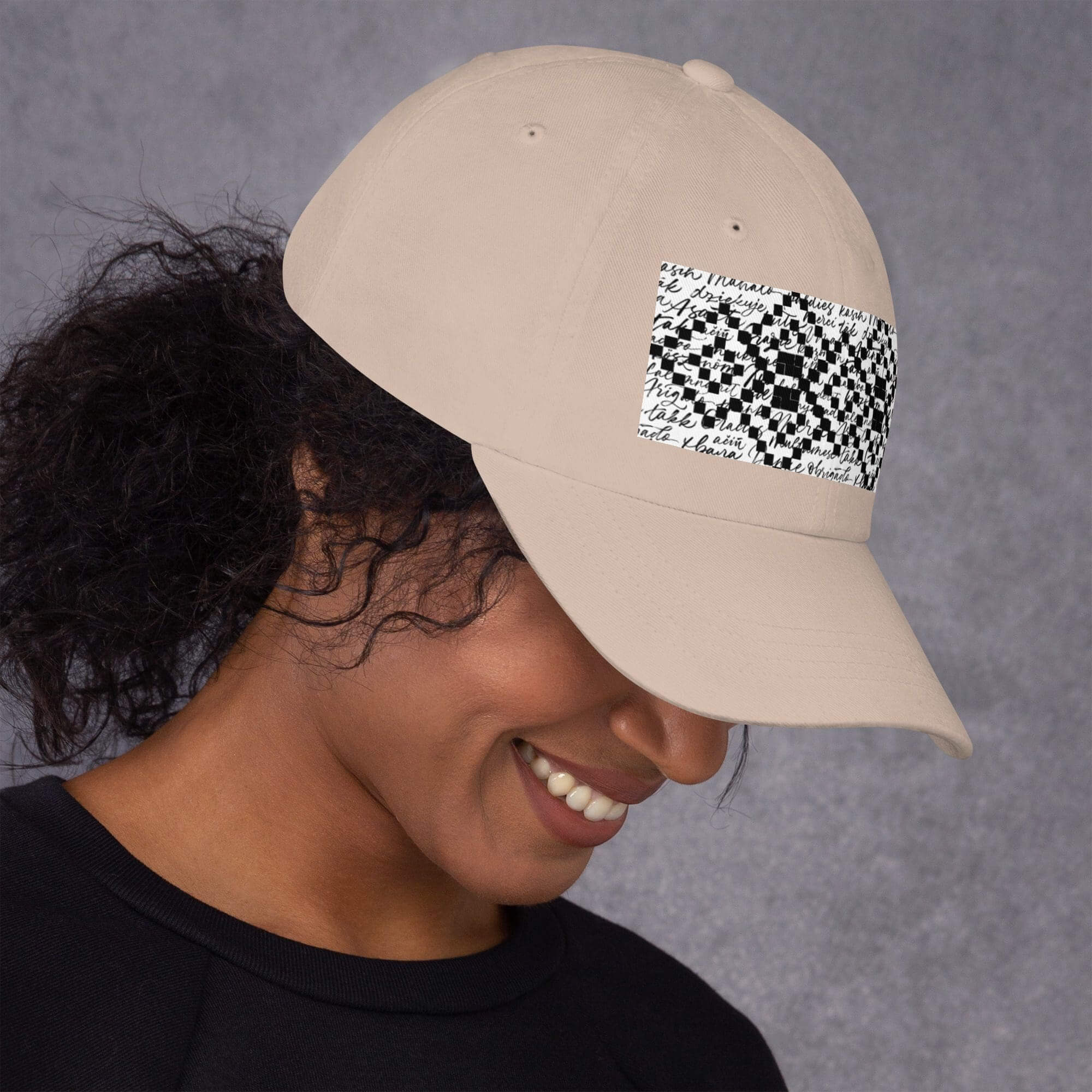Person wearing a beige cap, patterned design.