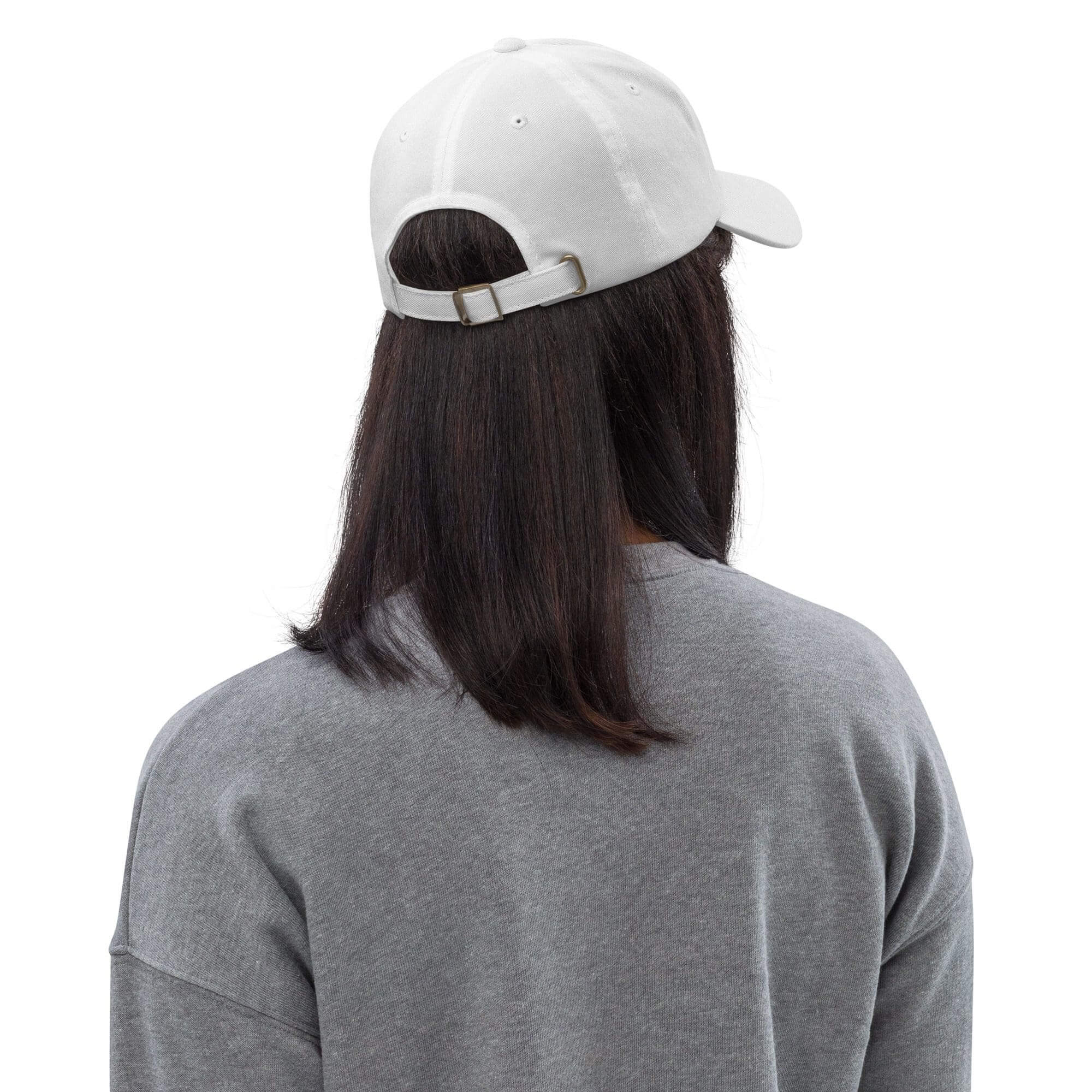 Person wearing white cap and gray shirt.