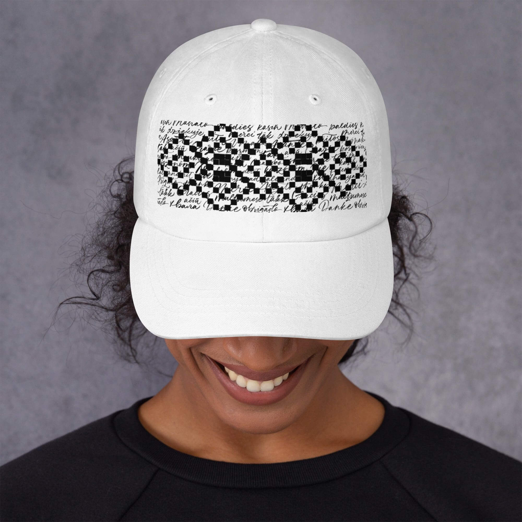 White cap with black geometric design.