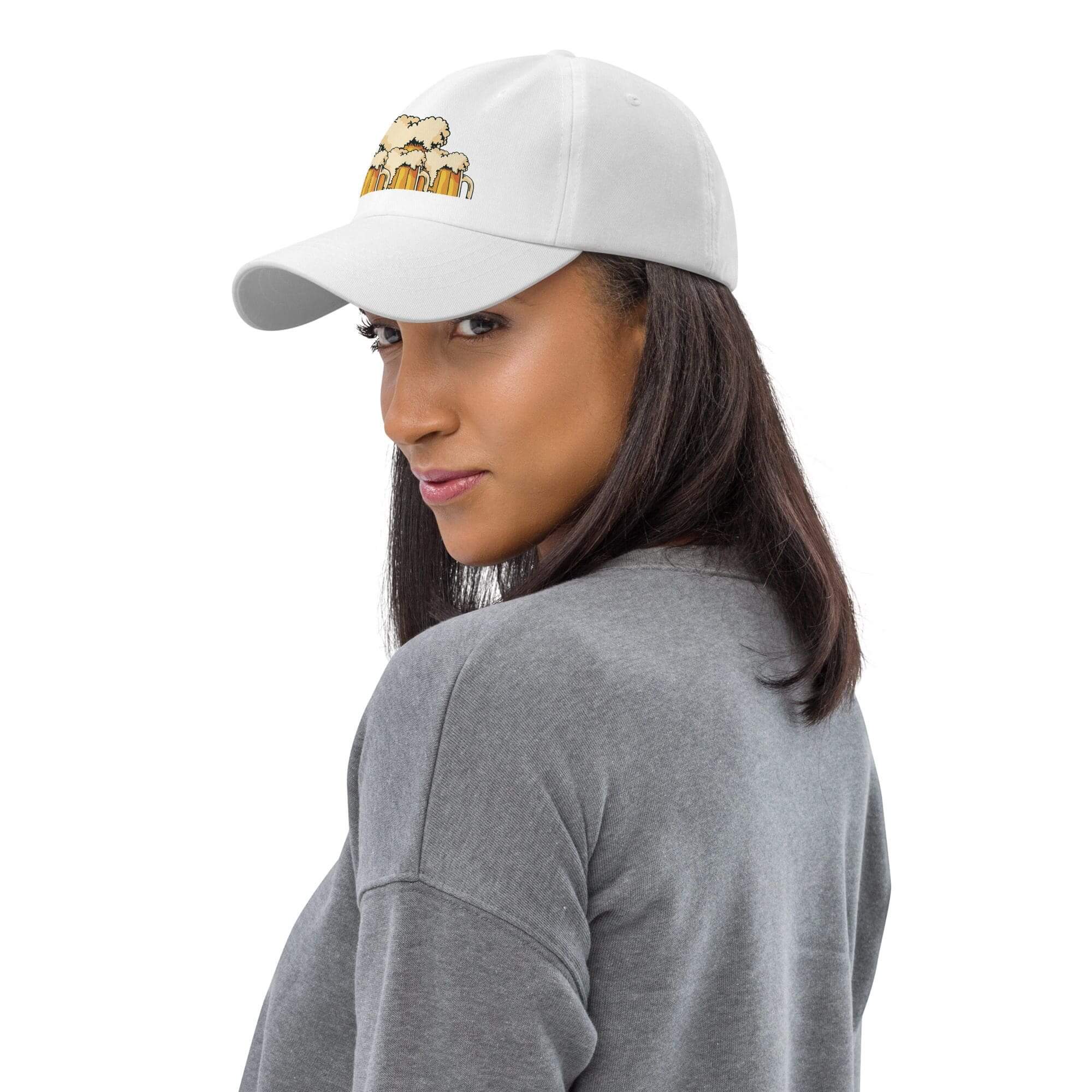 Woman wearing white cap and gray sweater.