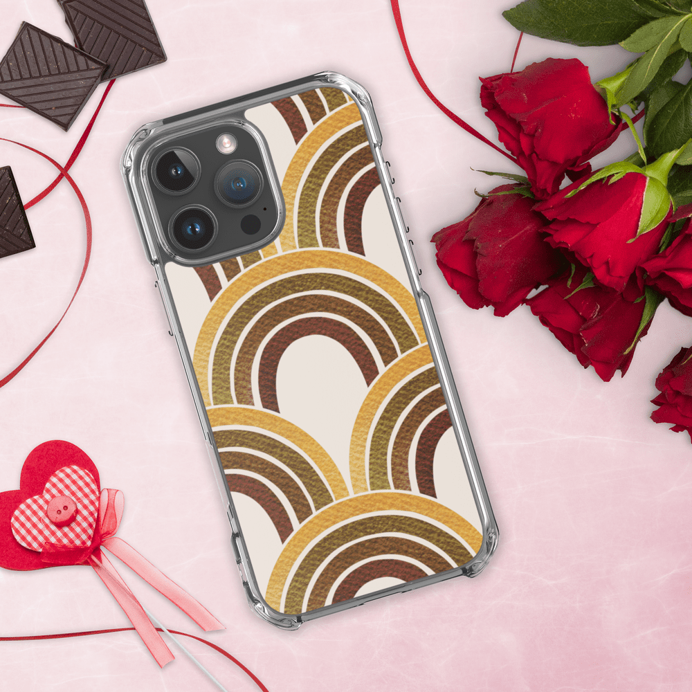 Phone with rainbow case, roses, and chocolates.