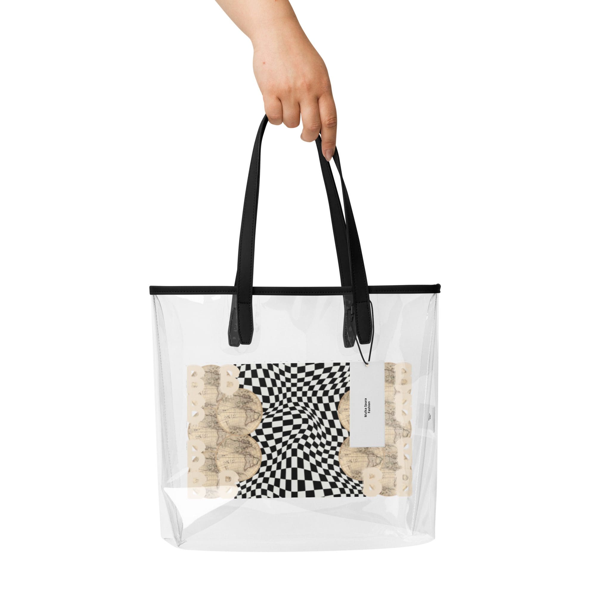Hand holding clear tote bag with design.