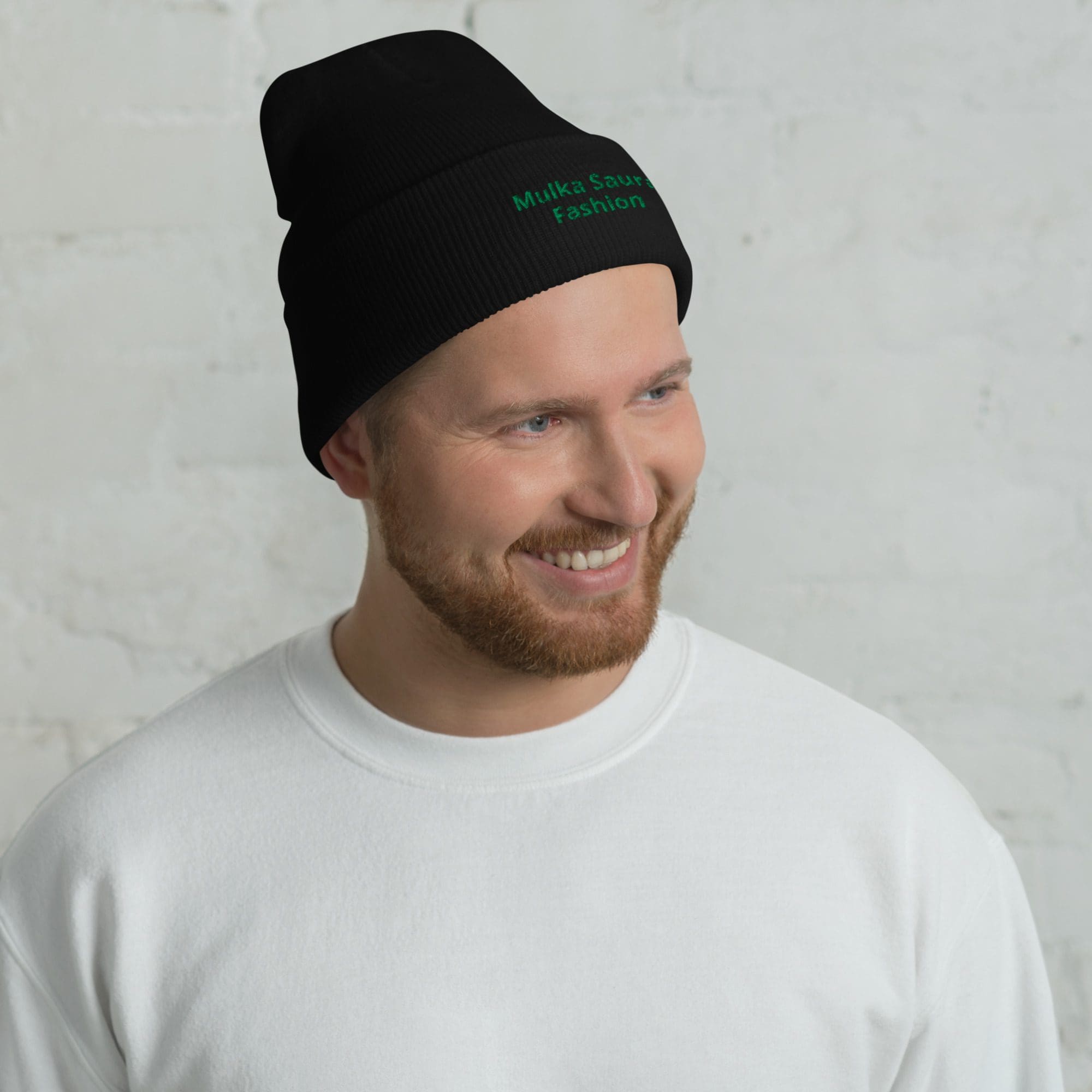 Smiling man wearing black beanie and sweatshirt.