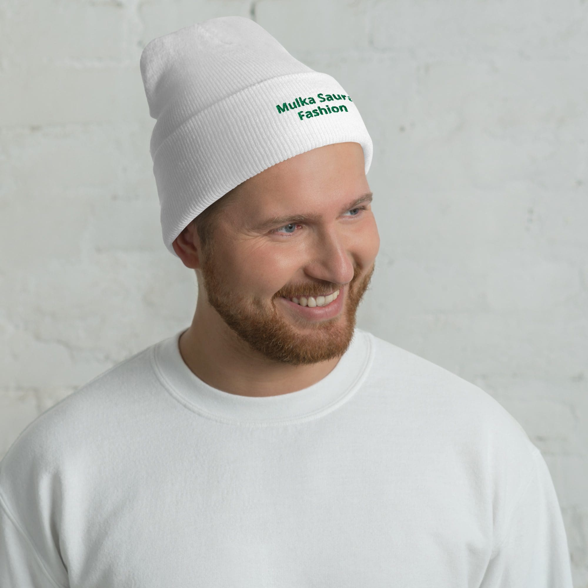 Man wearing white beanie and sweatshirt.
