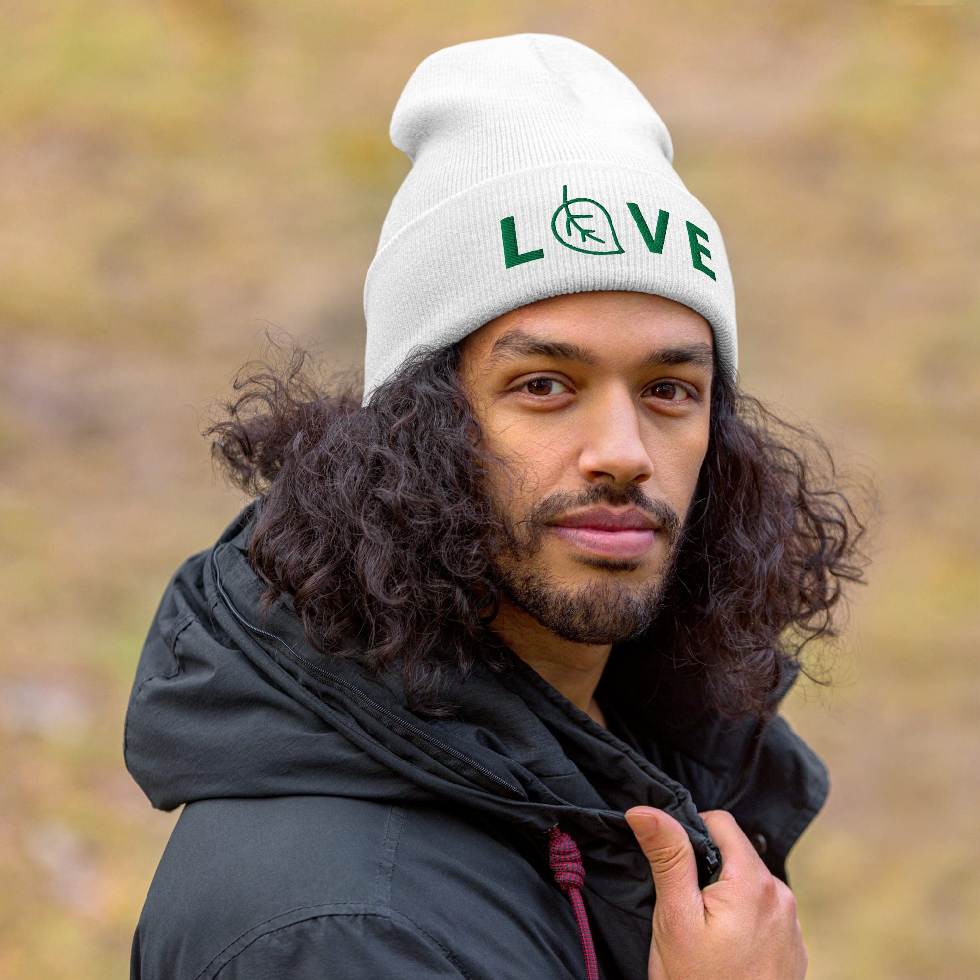 Man wearing a hat with "LOVE" text.