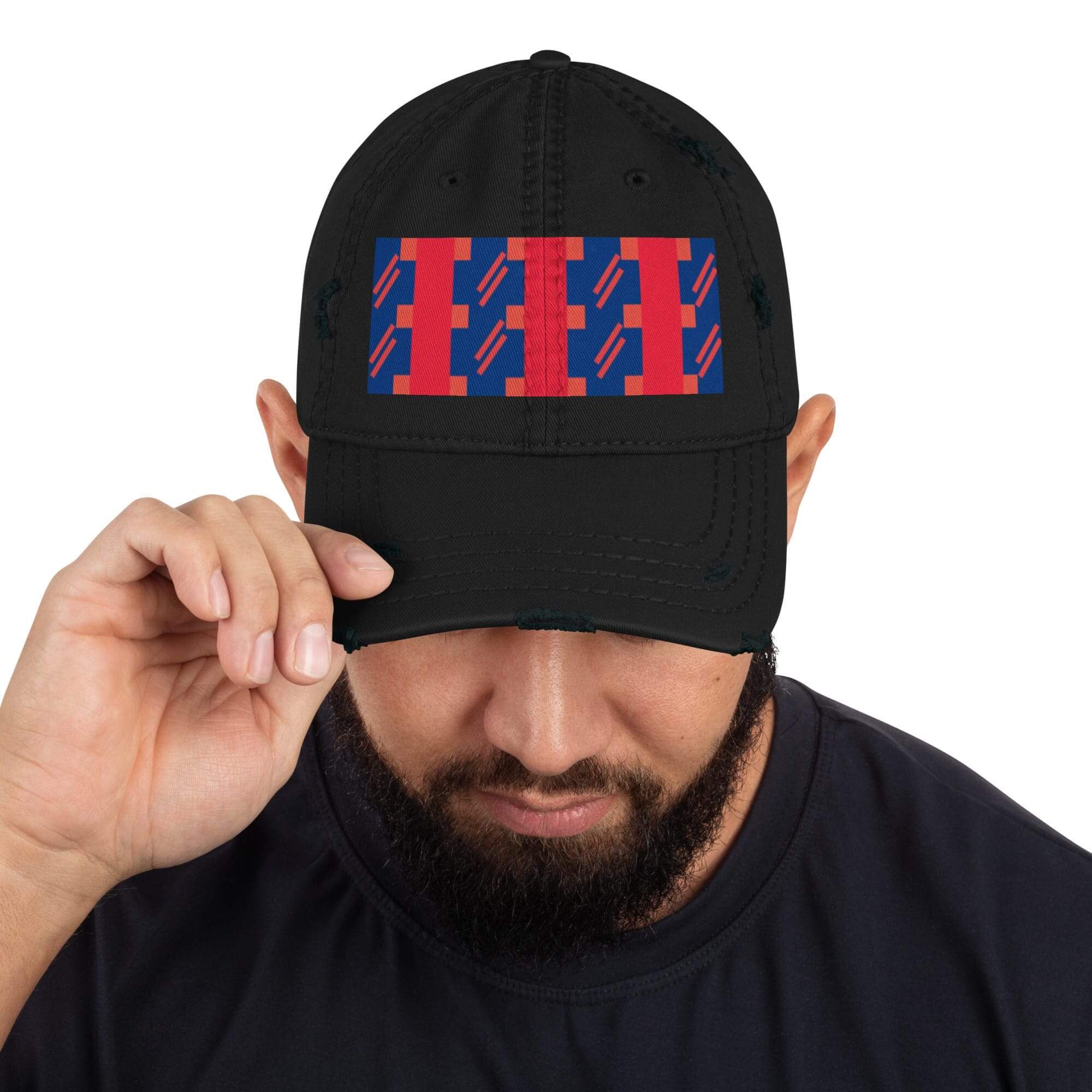 Man wearing a black cap with design.