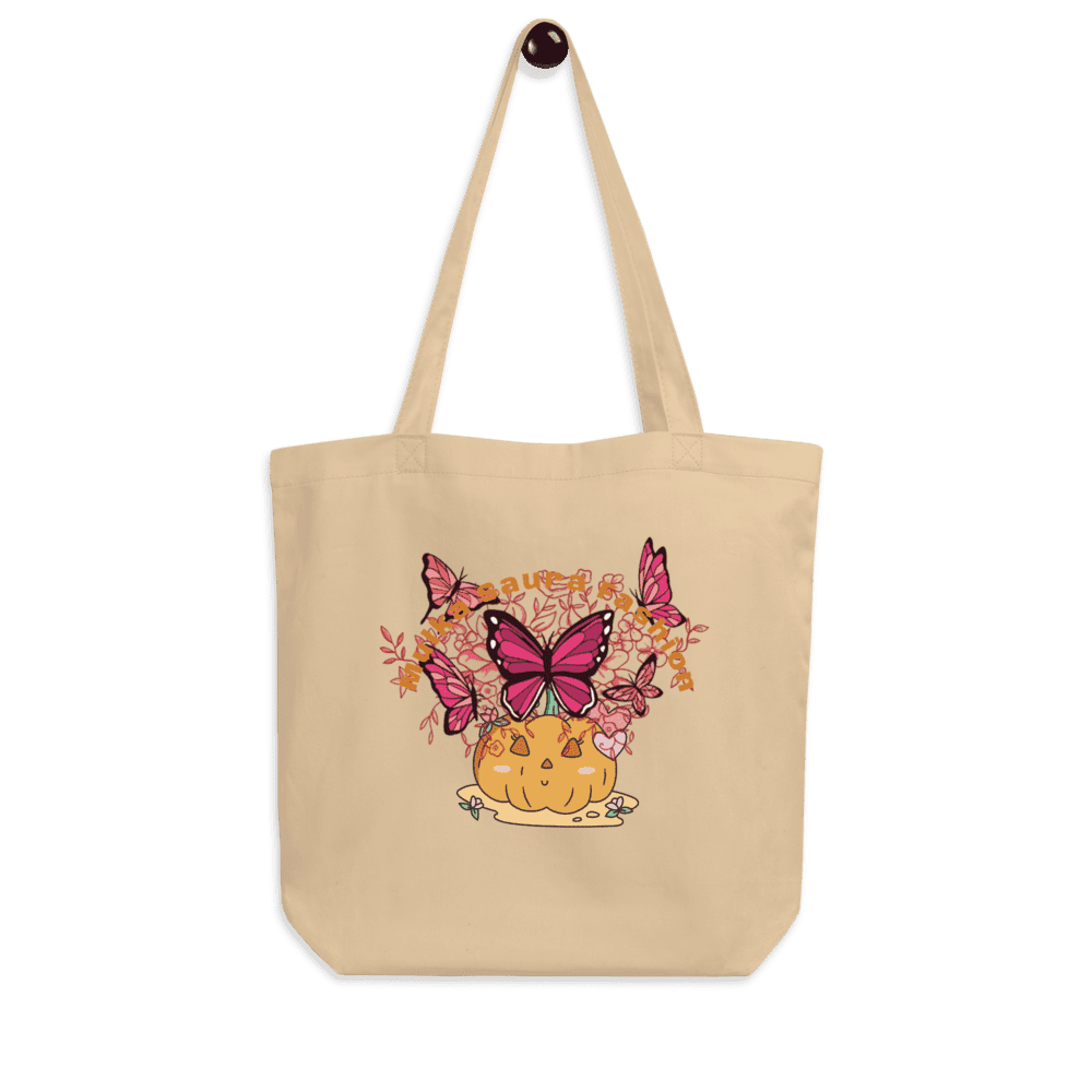 Beige tote bag with butterfly pumpkin design.