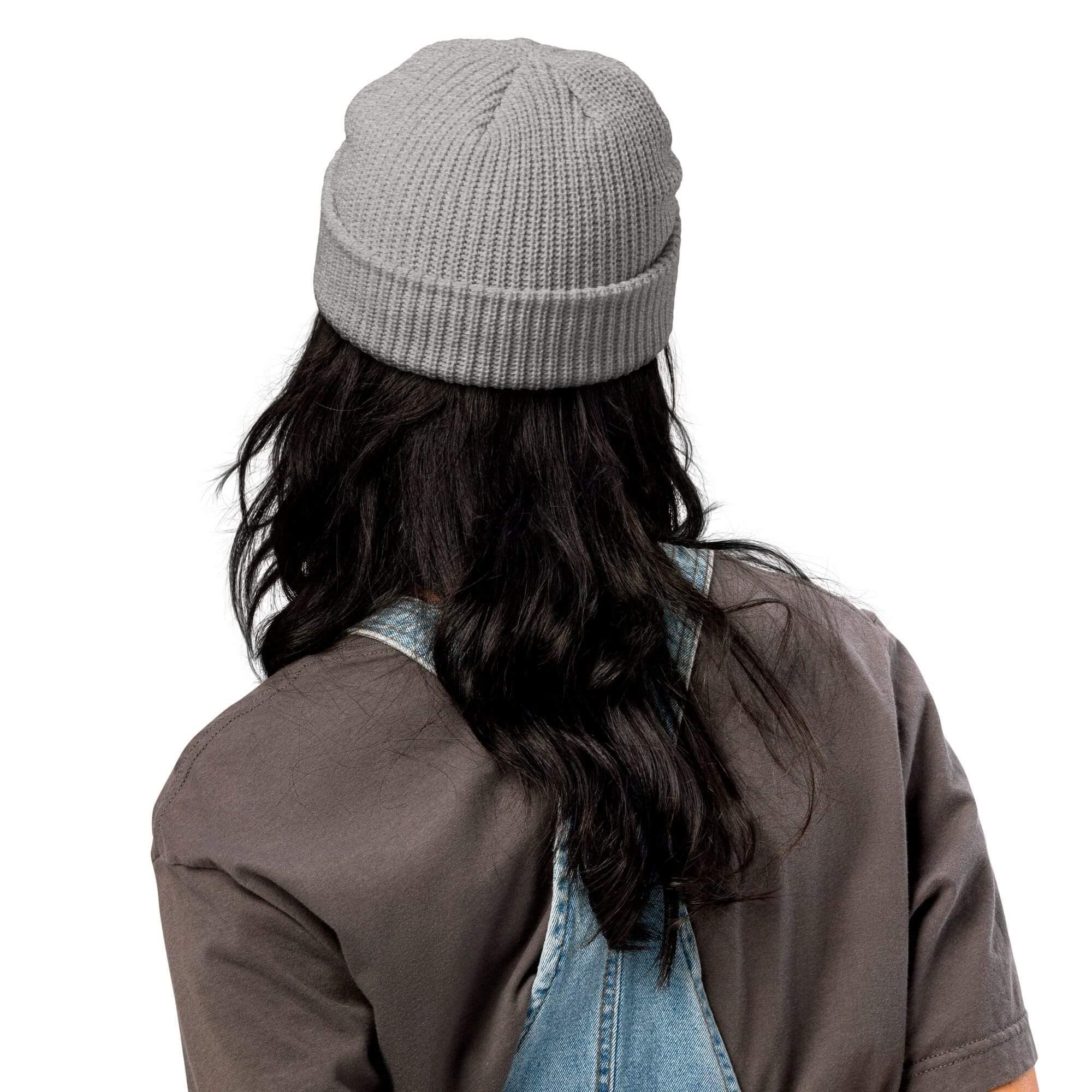 Person with long hair wearing gray beanie.
