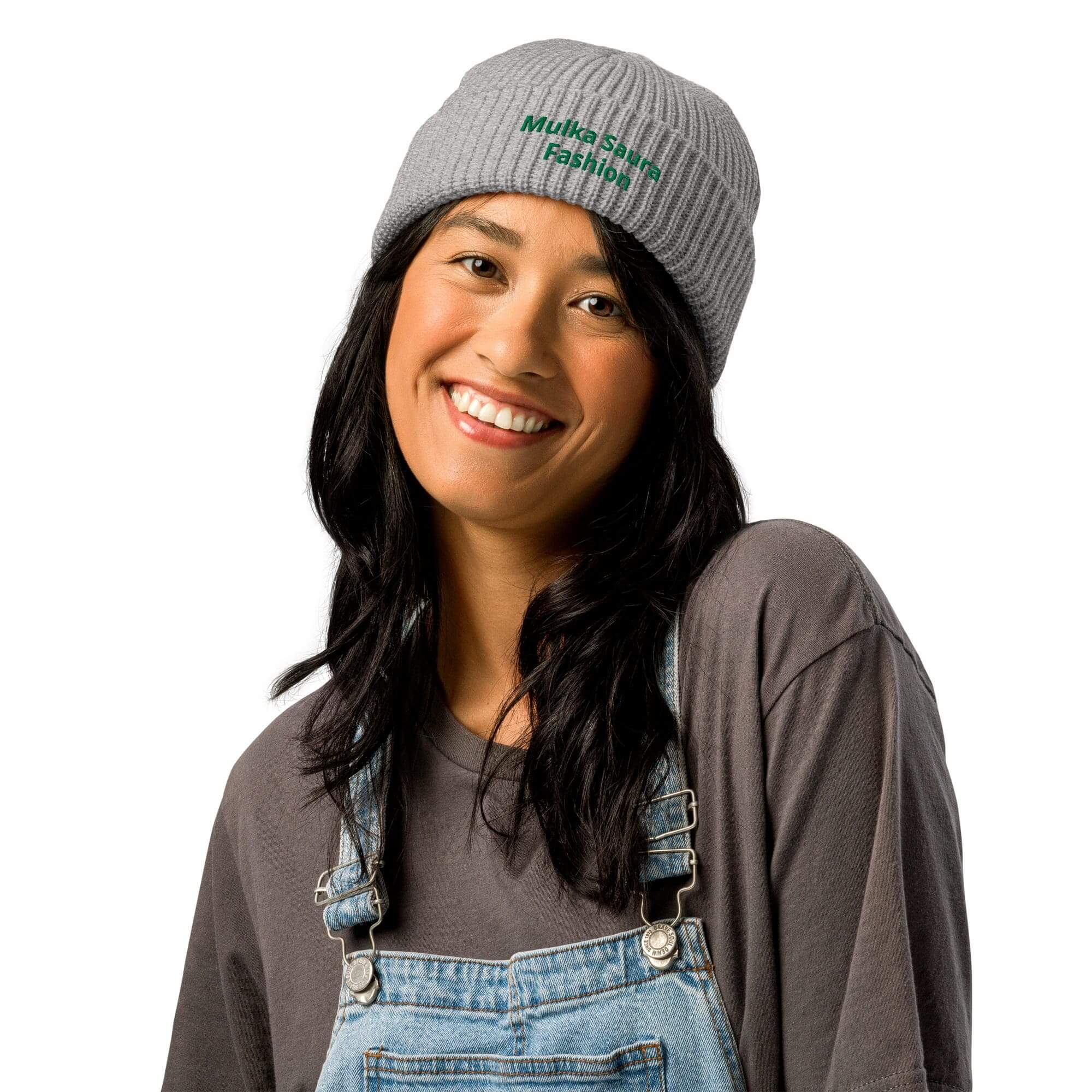 Smiling woman in gray beanie and overalls
