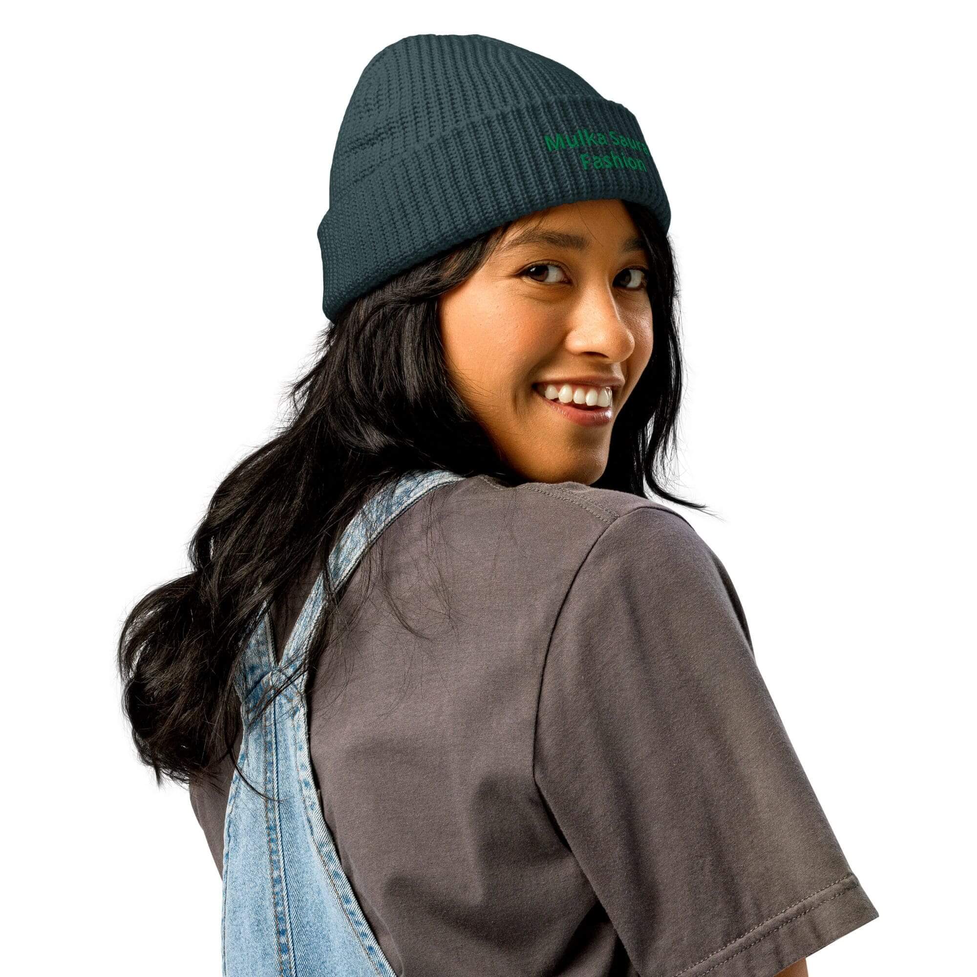 Smiling person wearing beanie and overalls.