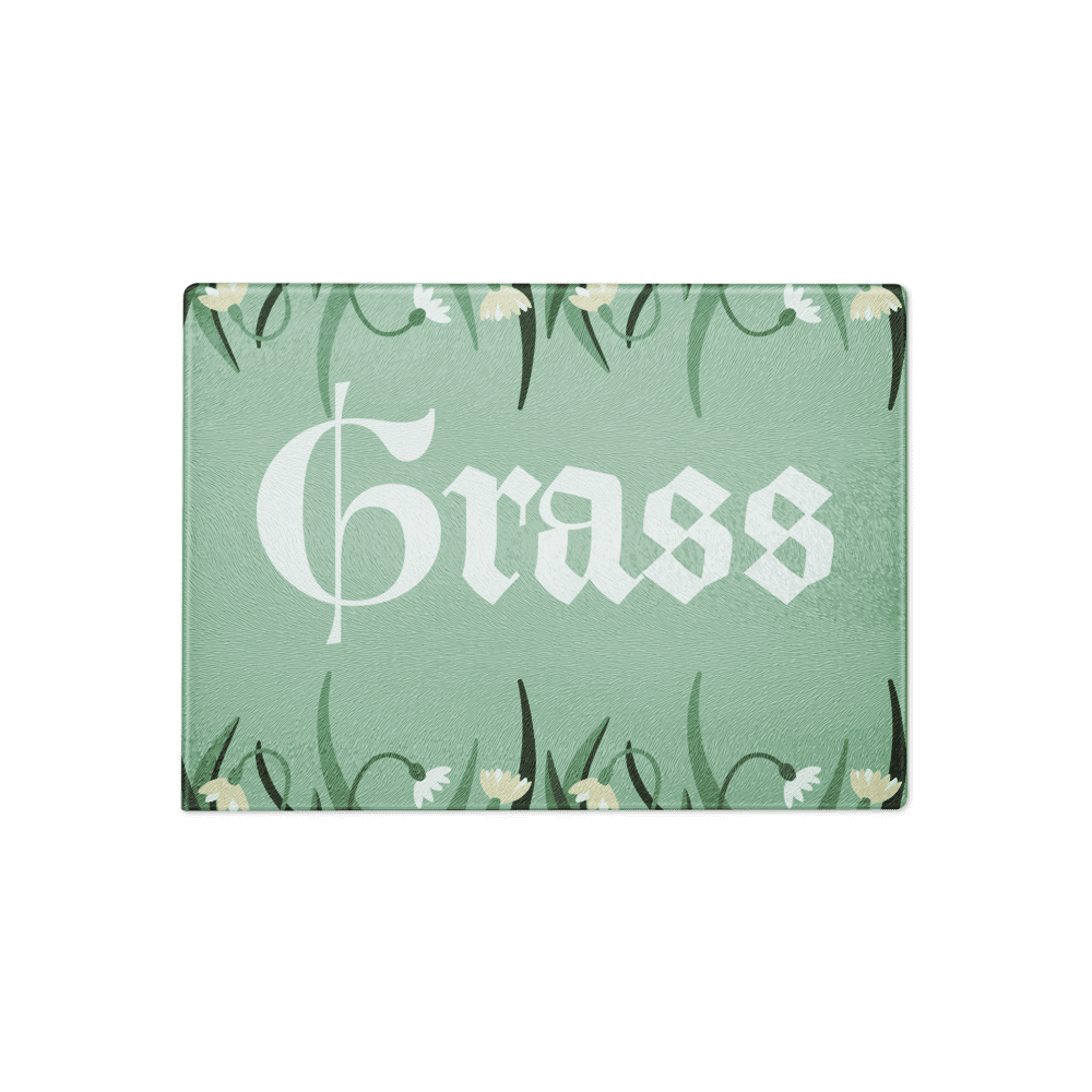 Green "Grass" sign with floral border.