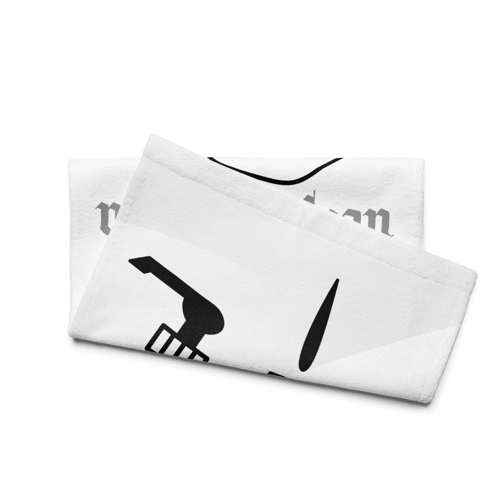 Folded white towel with black design.