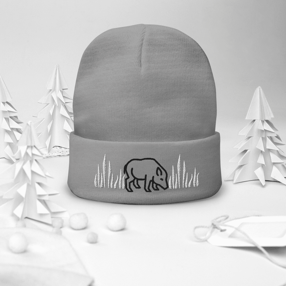 Gray beanie with boar design and trees.
