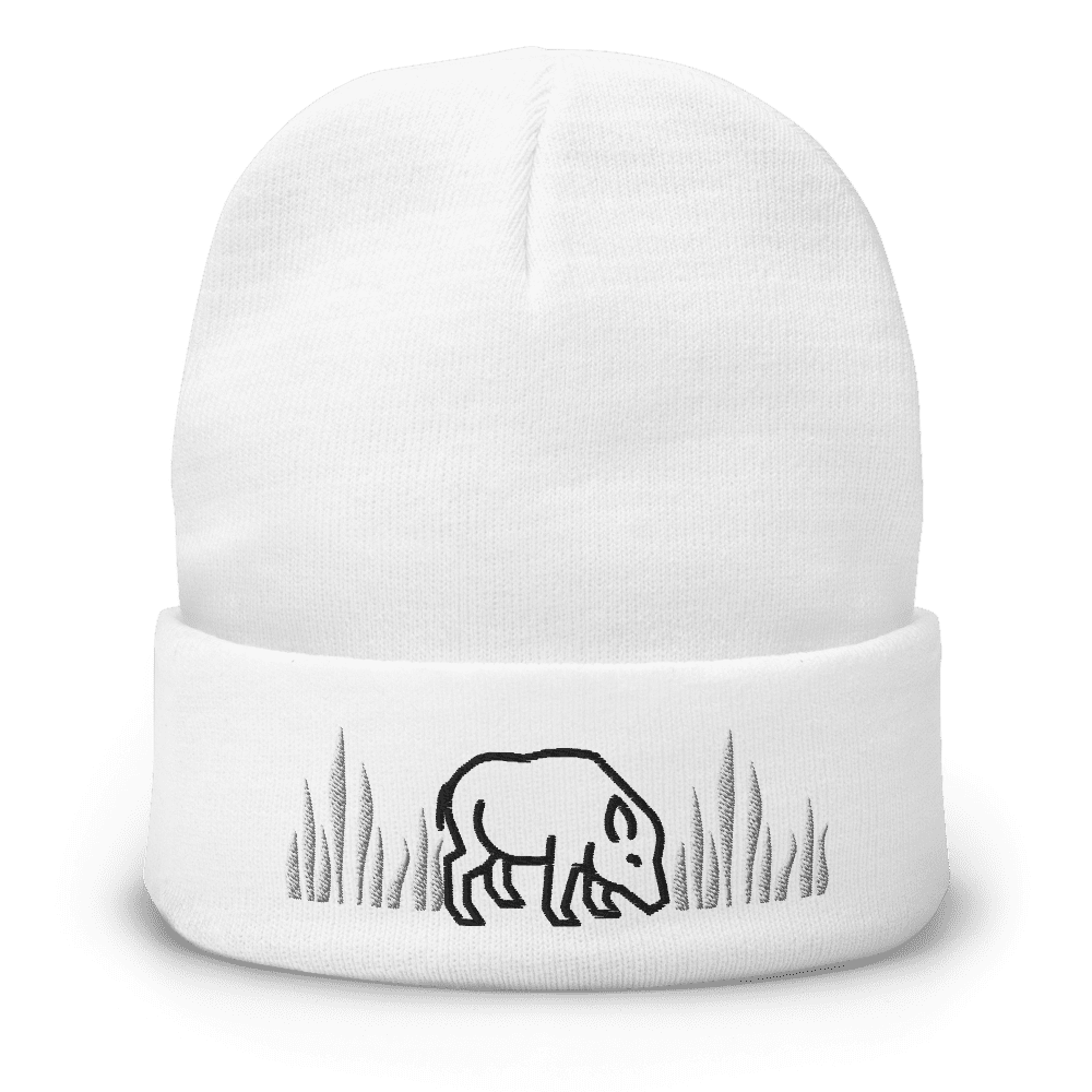 White beanie with bear and grass design.