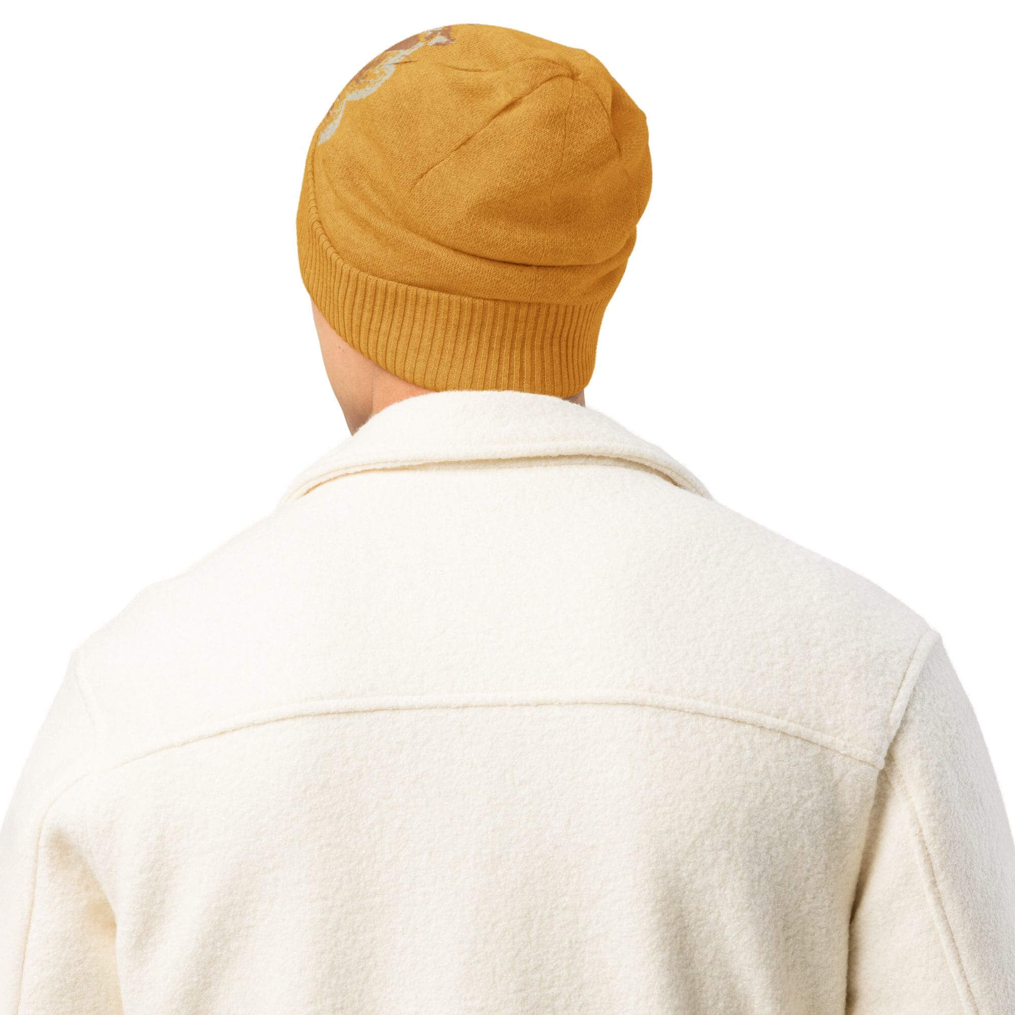 Person wearing yellow beanie and white jacket.