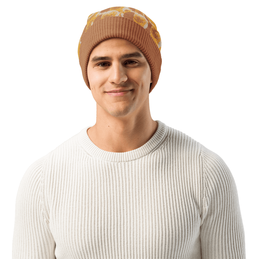 Man wearing brown beanie and white sweater.