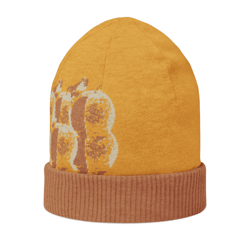 Orange beanie with textured abstract pattern.