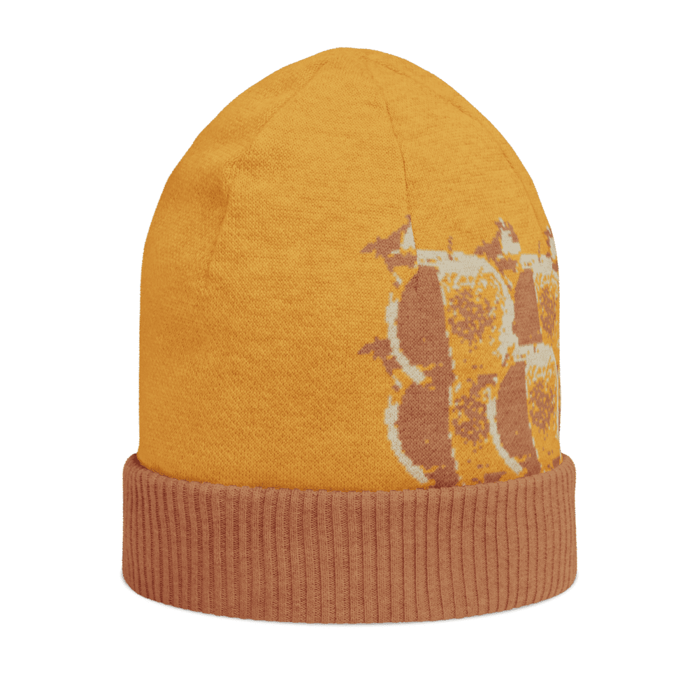 Orange beanie with giraffe pattern design.