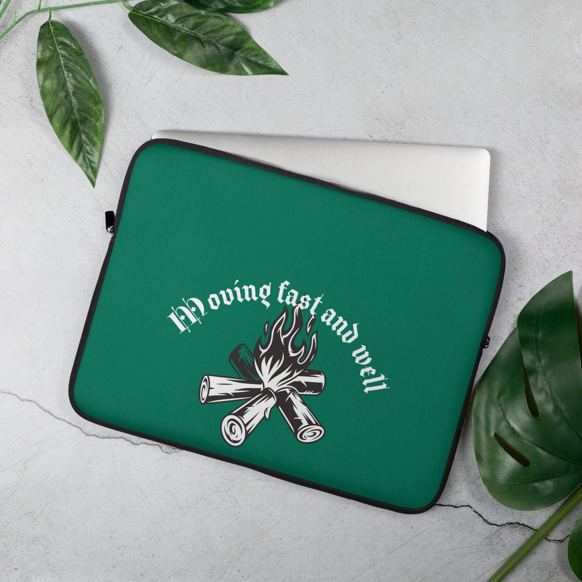 Green laptop sleeve with flame design.