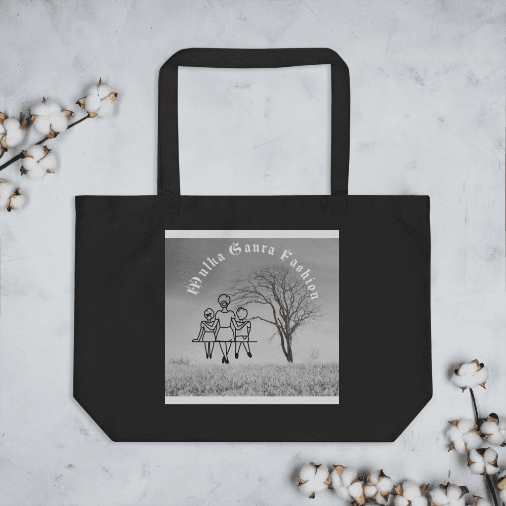 Black tote bag with artistic design print.