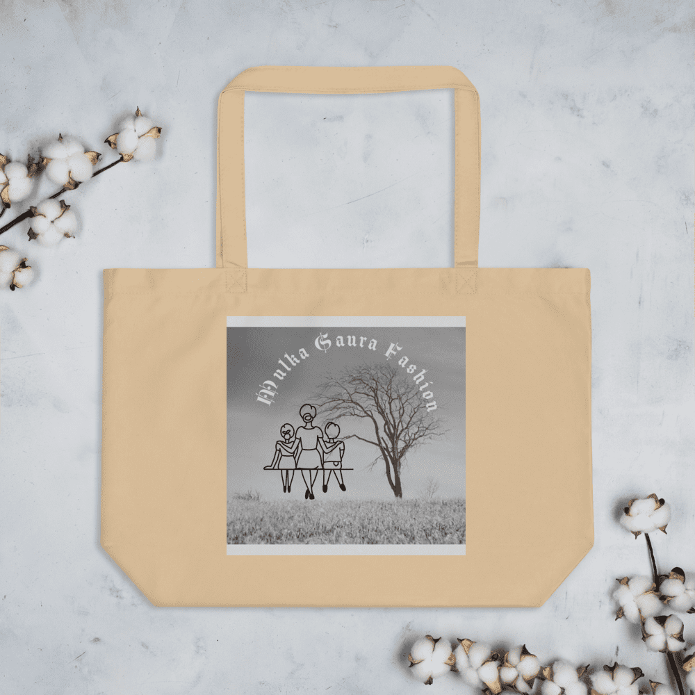 Beige tote bag with artistic design print.