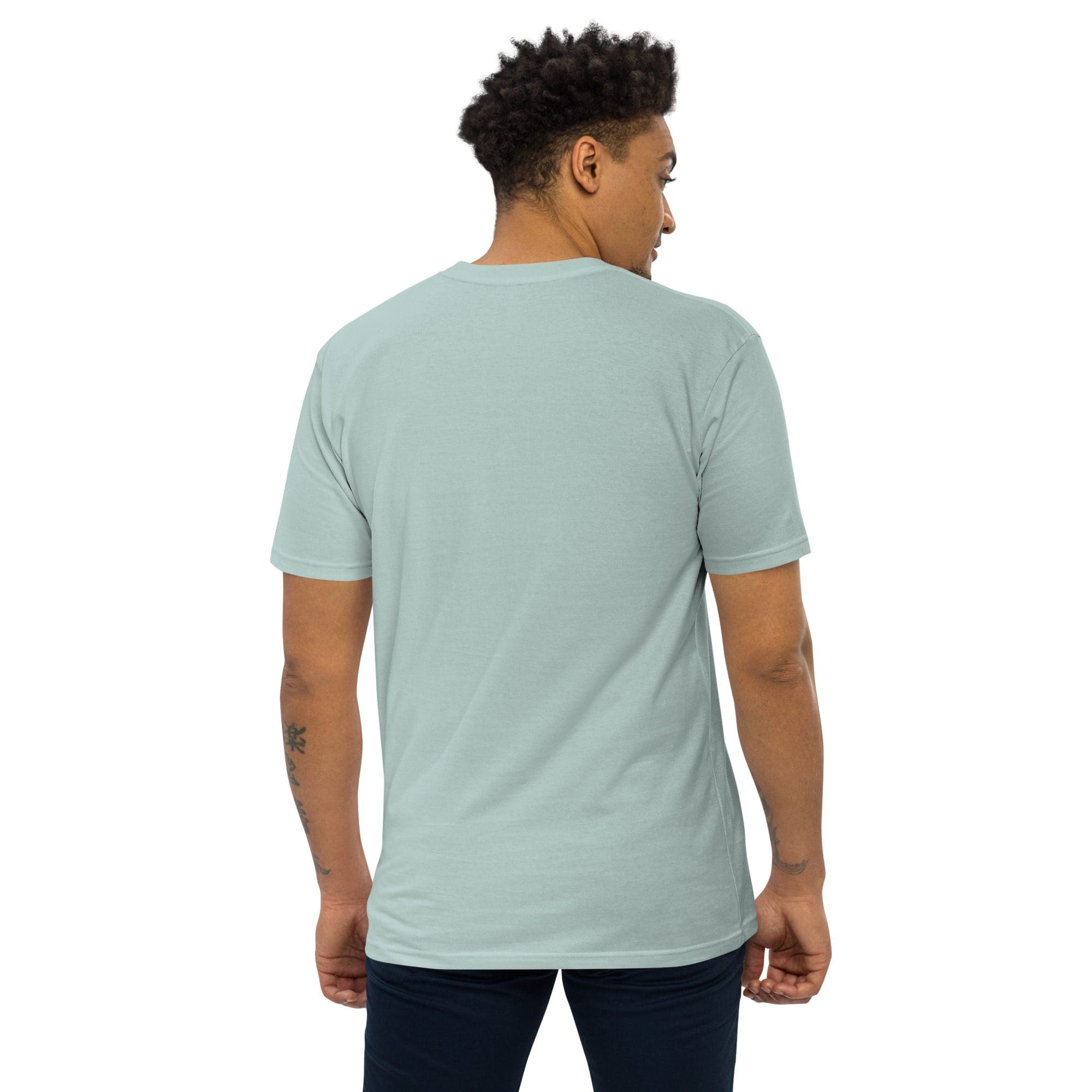 Man wearing light blue t-shirt, facing away.