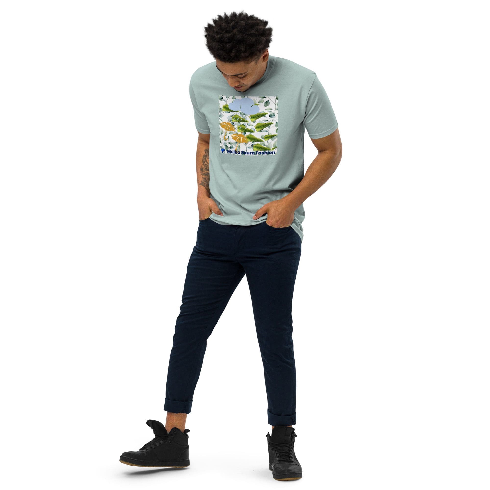 Man wearing graphic t-shirt and navy pants.